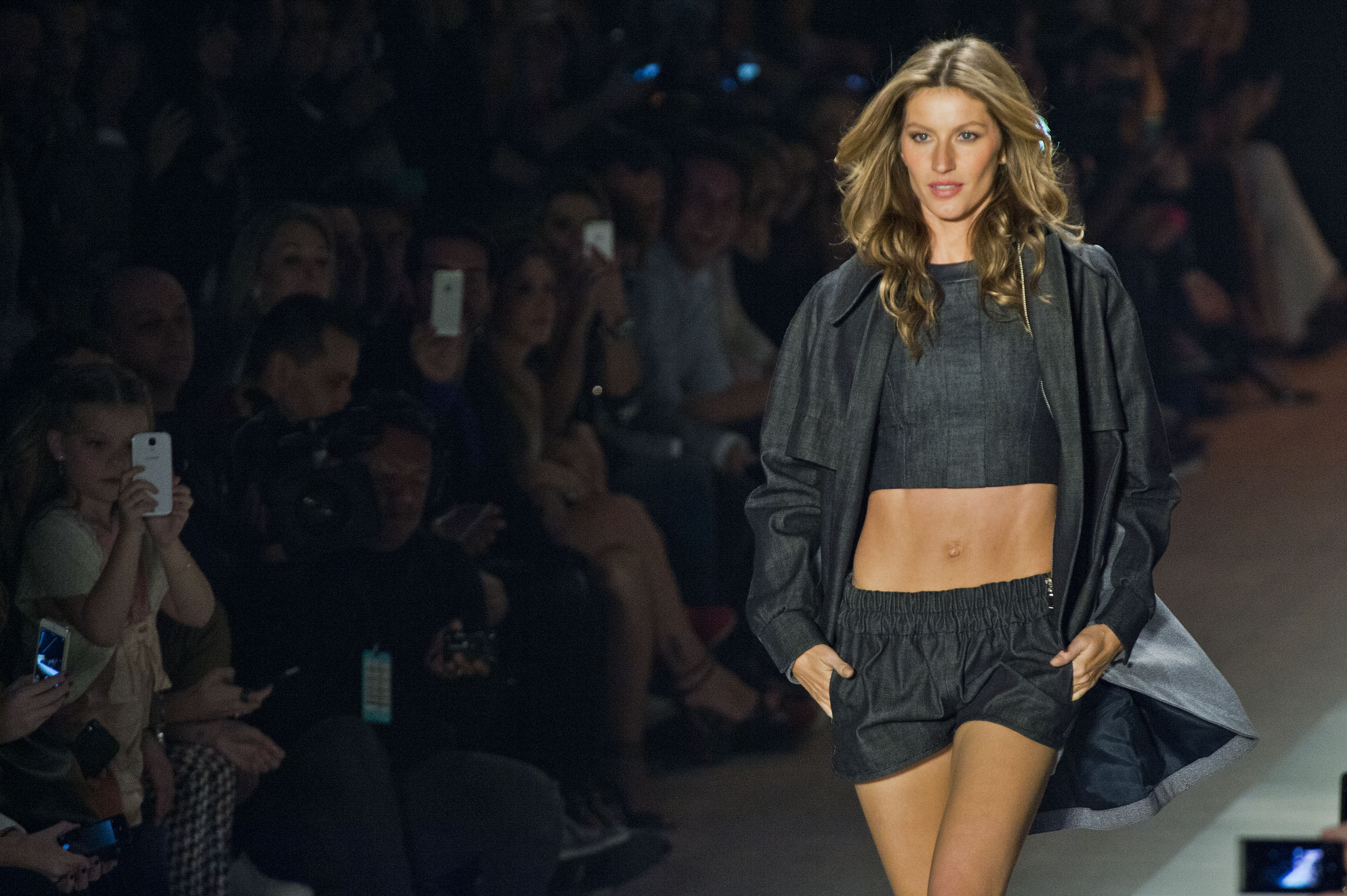 Brazilian supermodel Gisele Bundchen presents a creation by Colcci during the 2014 Winter collections of the Sao Paulo Fashion Week in Sao Paulo, Brazil, on October 31, 2013.