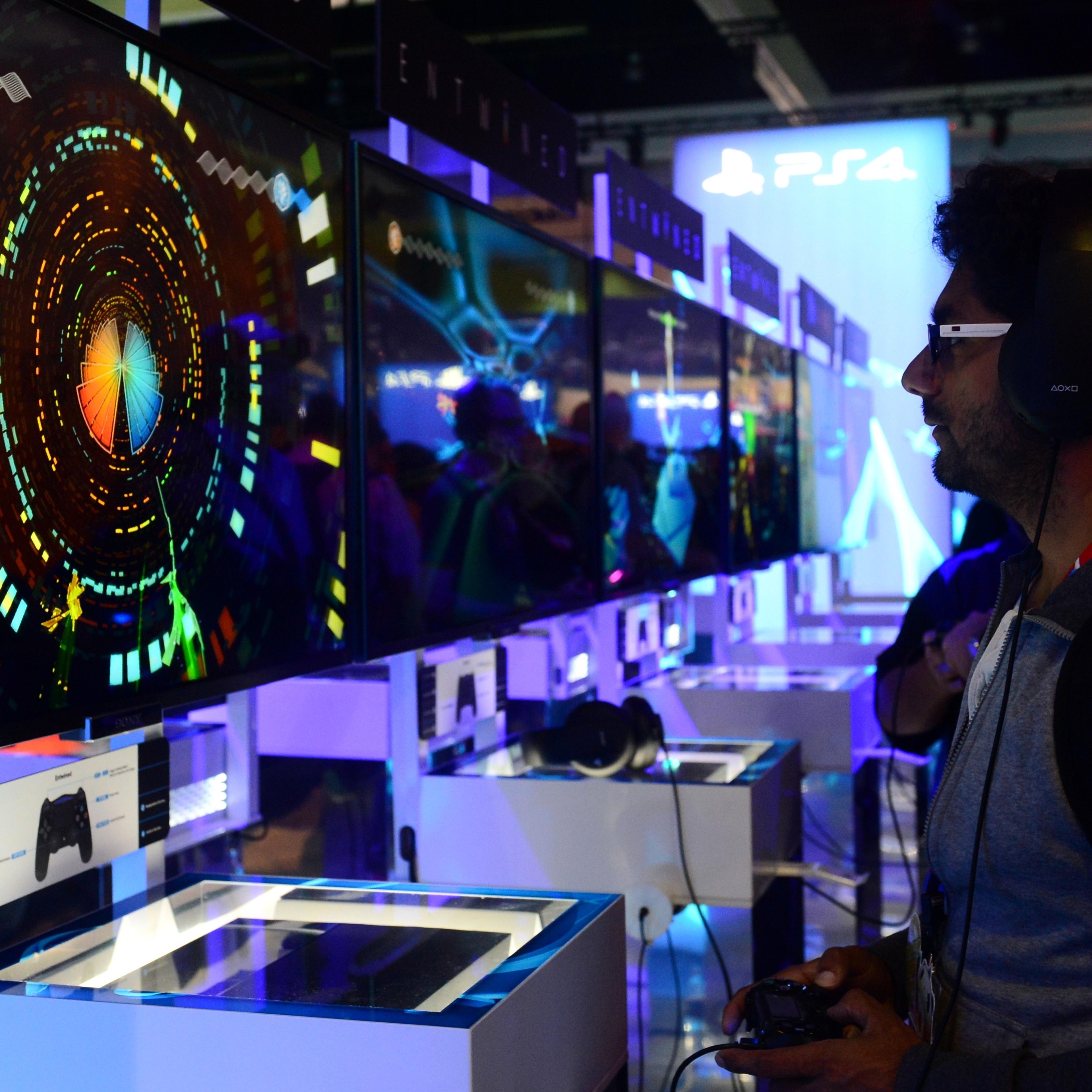 A gamer plays 'Entwined' on Sony's PS4 at annual E3 video game extravaganza in Los Angeles on June 10, 2014.