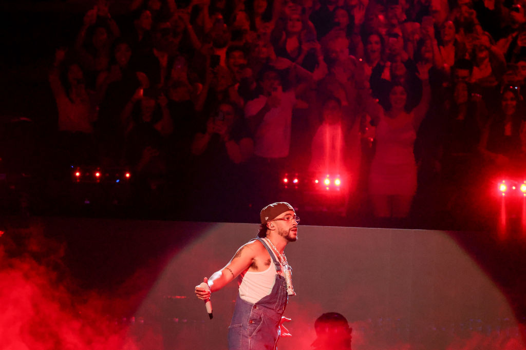 Bad Bunny performing in front of a crowd