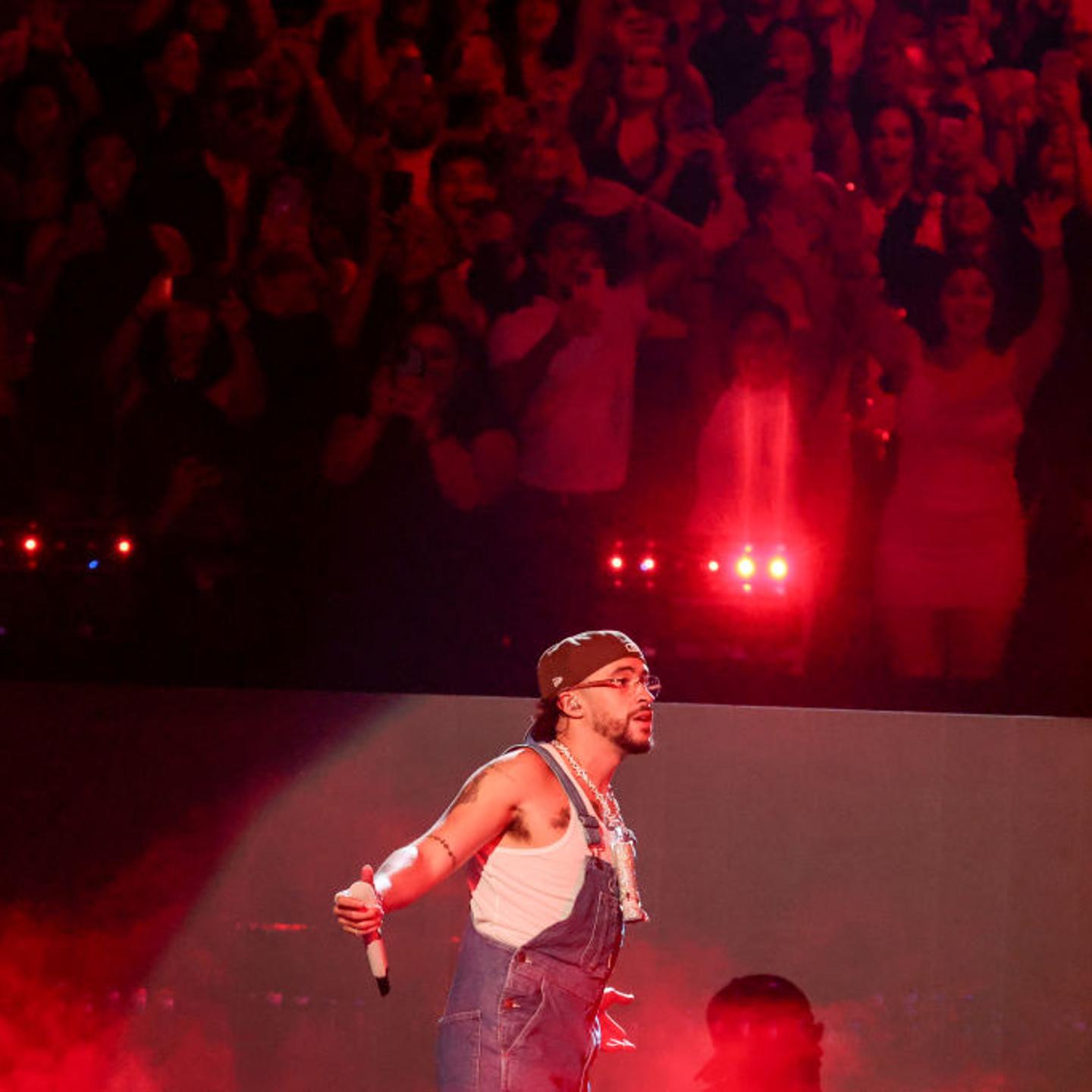 Bad Bunny performing in front of a crowd