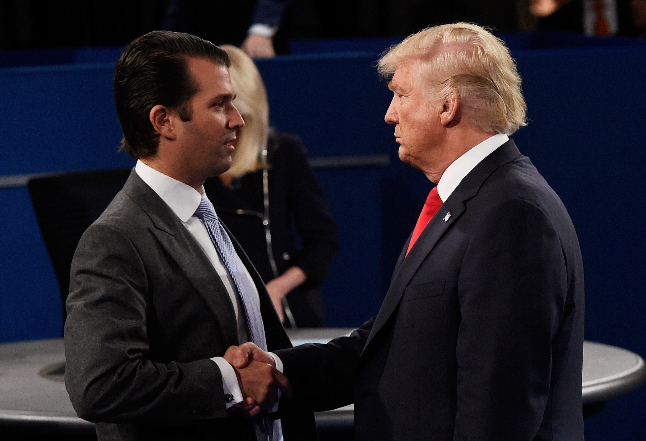 President Trump and Don Jr. shake hands