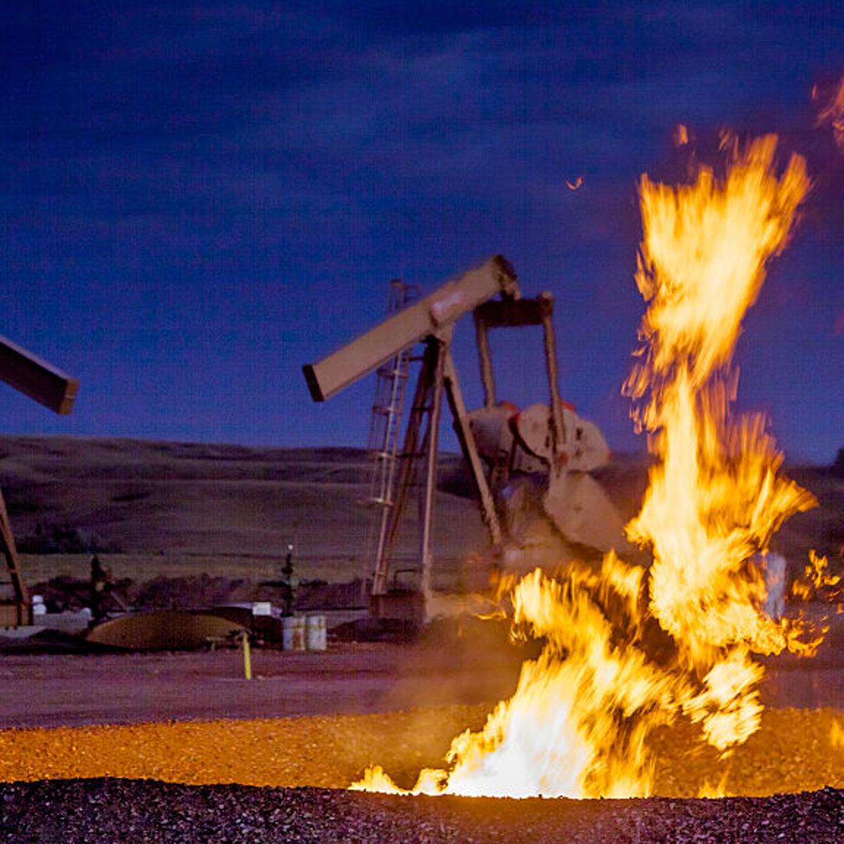 Flames from a flaring pit near a well in the Bakken Oil Field. The primary component of natural gas is methane, which is odorless when it comes directly out of the gas well.