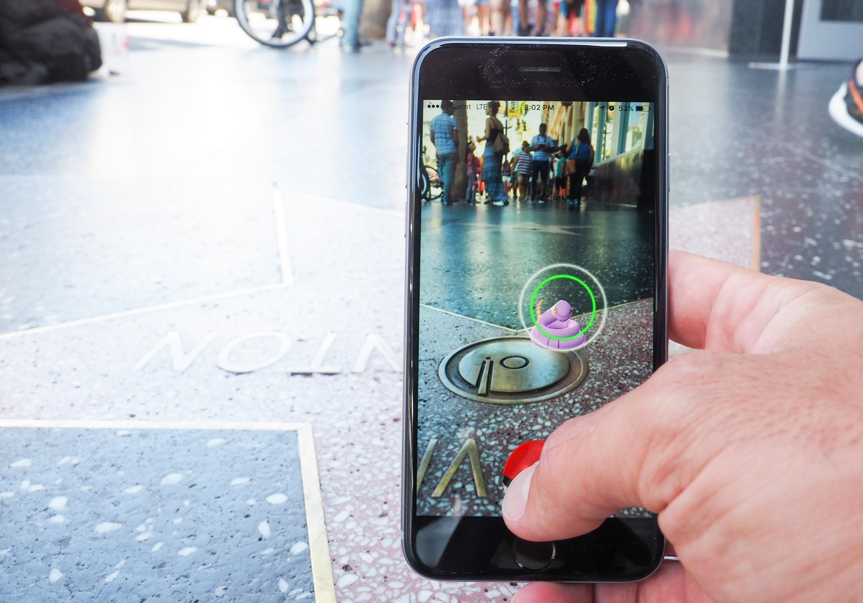 Pokemon Go players are seen on the Hollywood Blvd in search of Pokemon and other in game items on July 14, 2016 in Los Angeles, California.