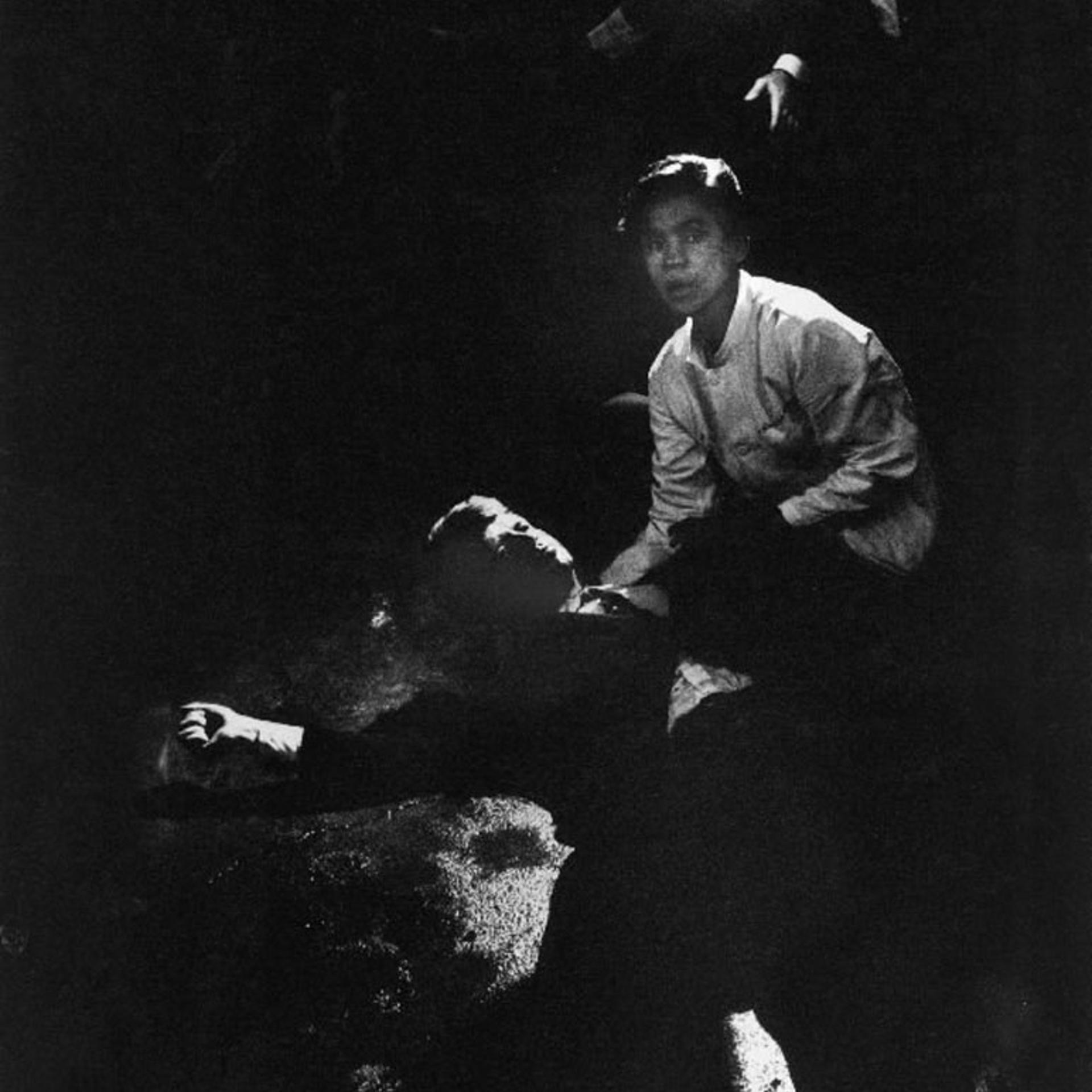 June 6, 1968. "Rigid, semiconscious, his face an ashen mask, Senator Kennedy lies in a pool of his own blood on the concrete floor, a bullet deep in his brain and another in his neck. Juan Romero, a busboy whose hand Kennedy had shaken before the shots, tried to comfort him."