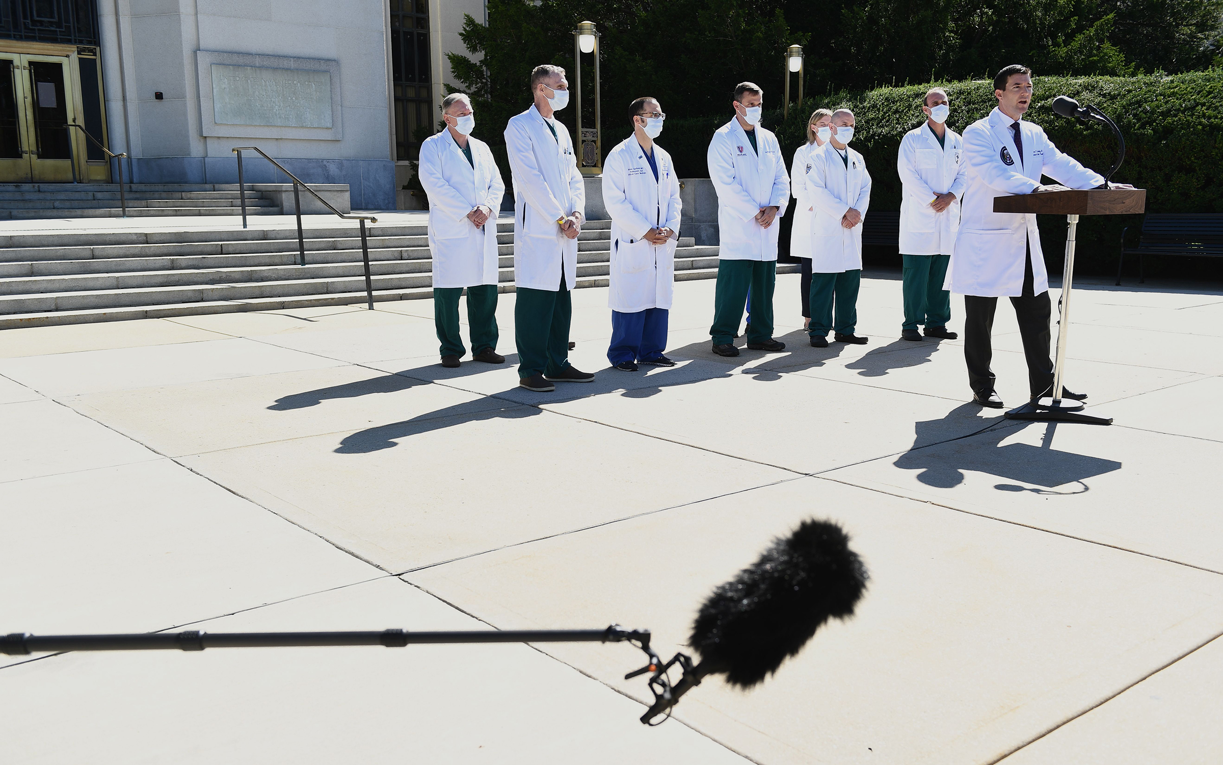 White House physician Dr. Sean Conley, right, provides an update on President Trump's condition at Walter Reed in Bethesda, Md., on Oct. 3, 2020.