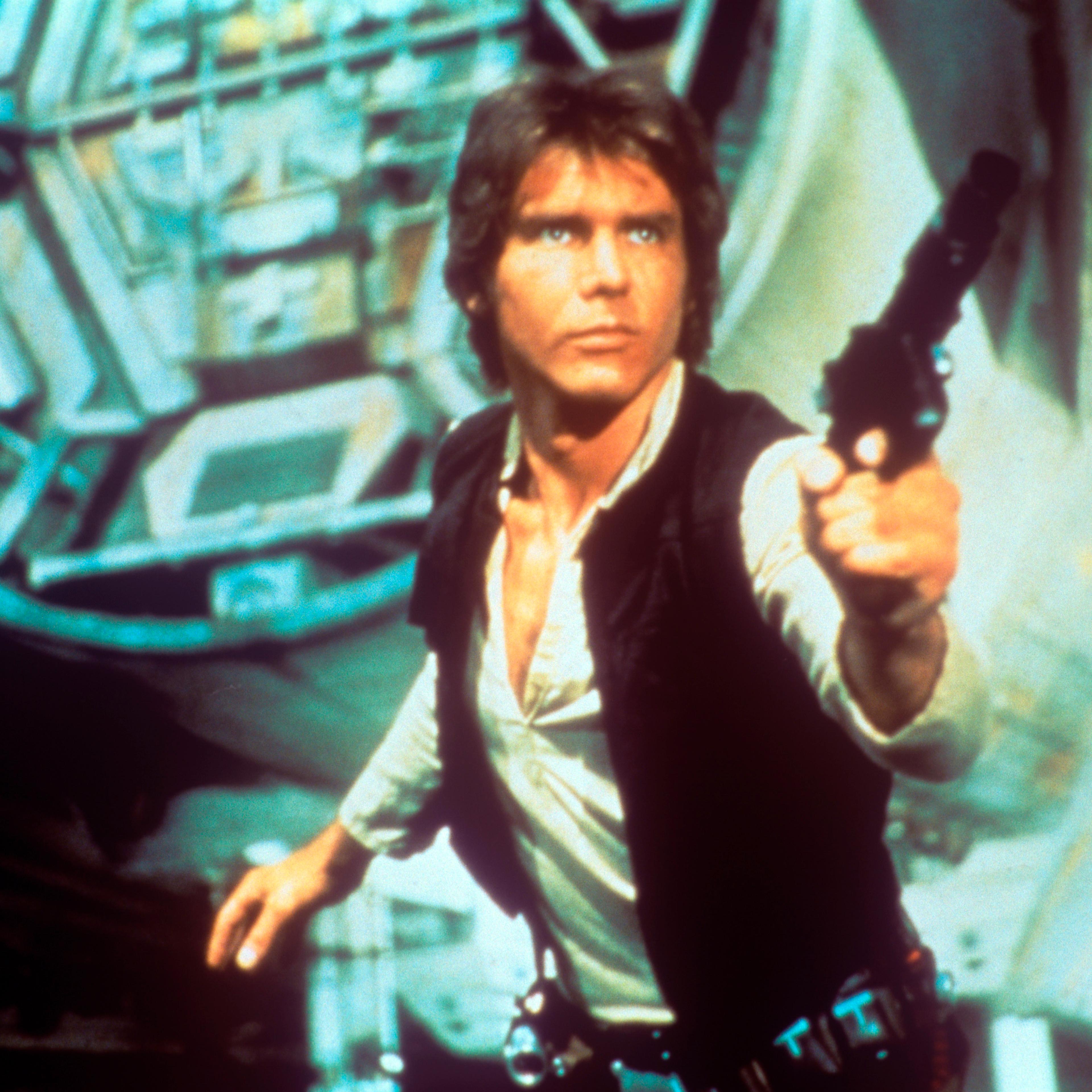 Harrison Ford drawing a gun