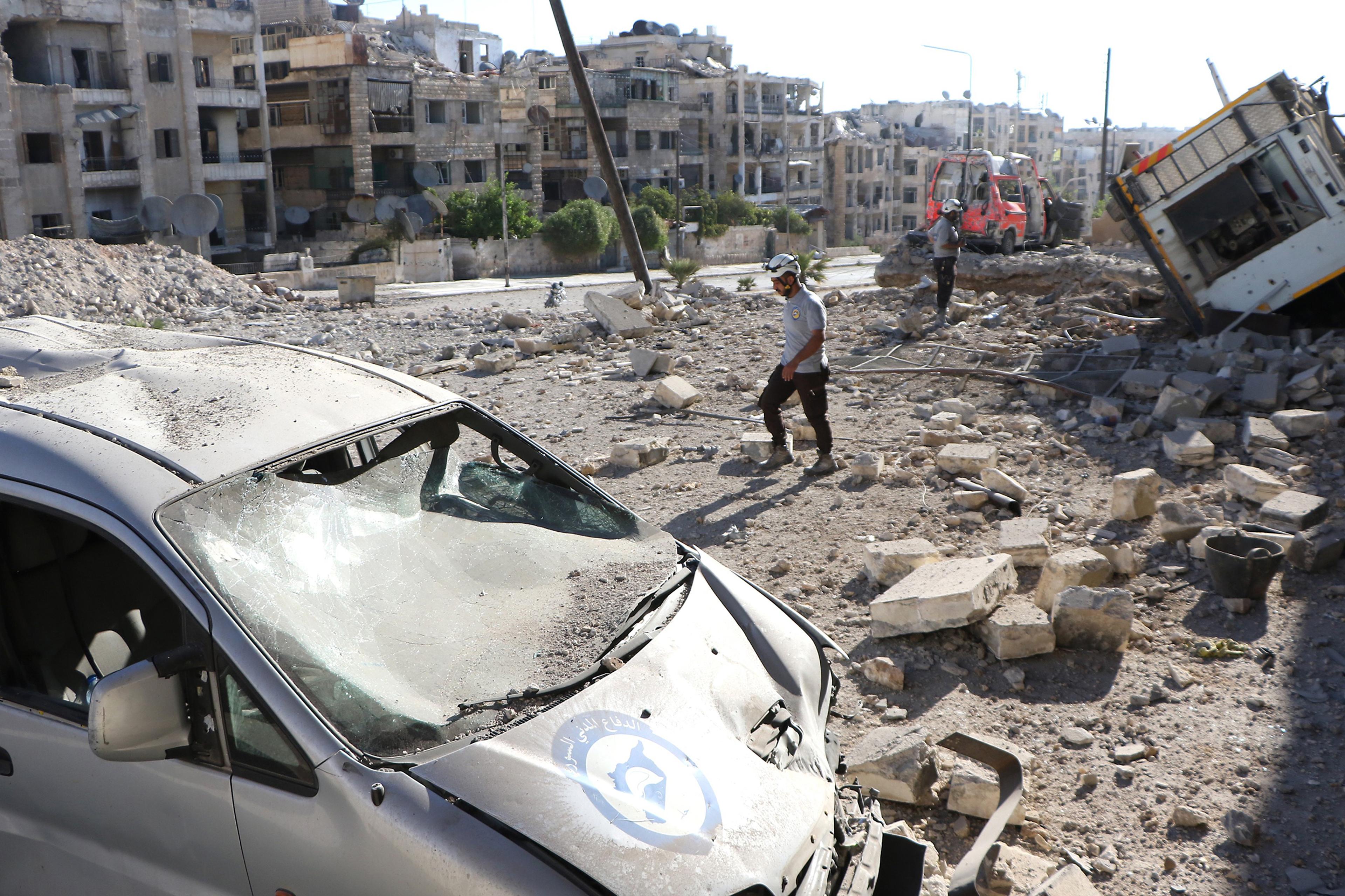 Debris of buildings and destroyed vehicles are seen after suspected Russian warplanes hit the civil defense center at Al-Ansari, in the rebel-held section of Aleppo, Syria, on Sept. 23, 2016.