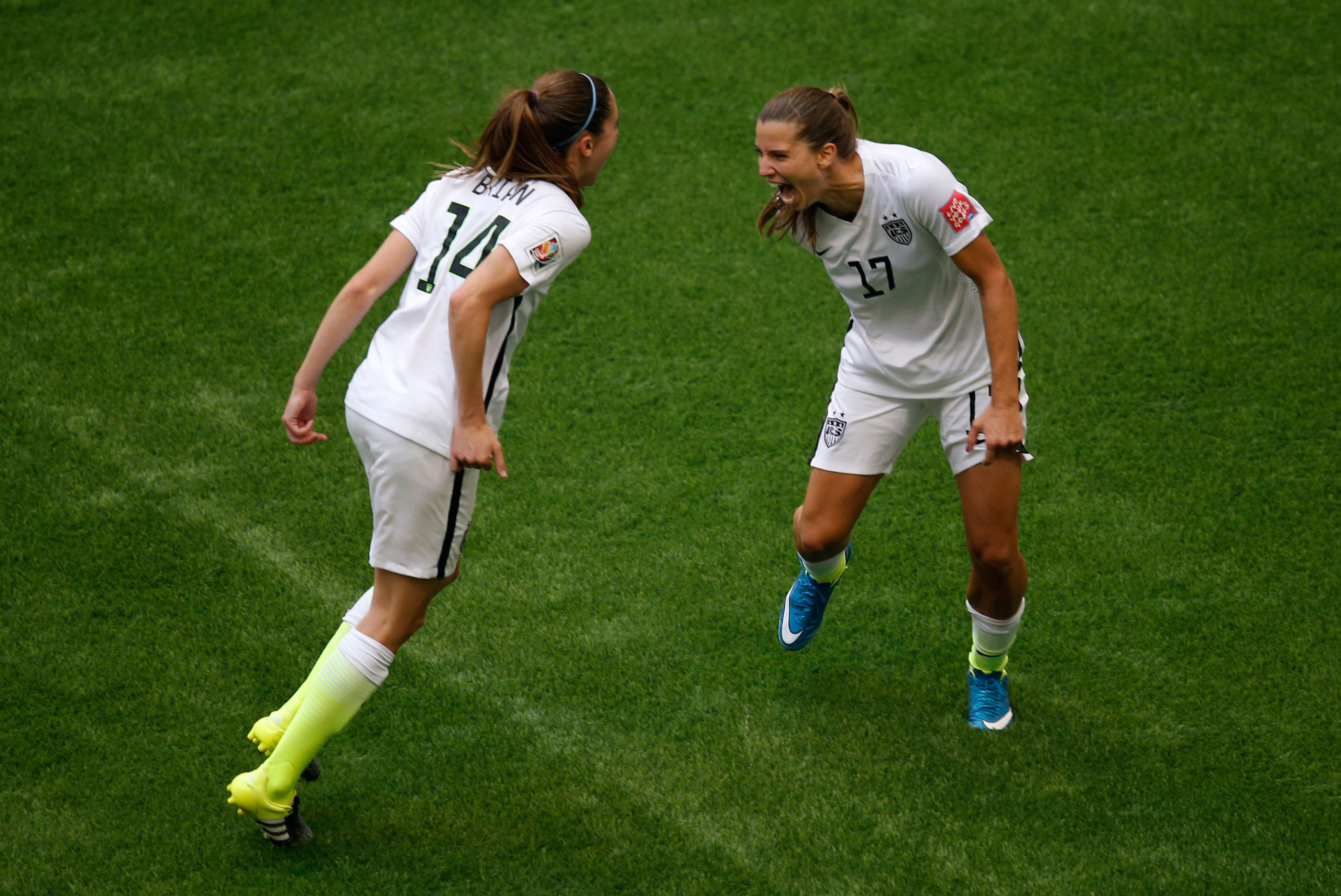 Jul 5, 2015; Vancouver, British Columbia, CAN; United States midfielder Tobin Heath (17) celebrates with midfielder Morgan Brian (14) after scoring against Japan during the second half of the final of the FIFA 2015 Women's World Cup at BC Place Stadium. 
