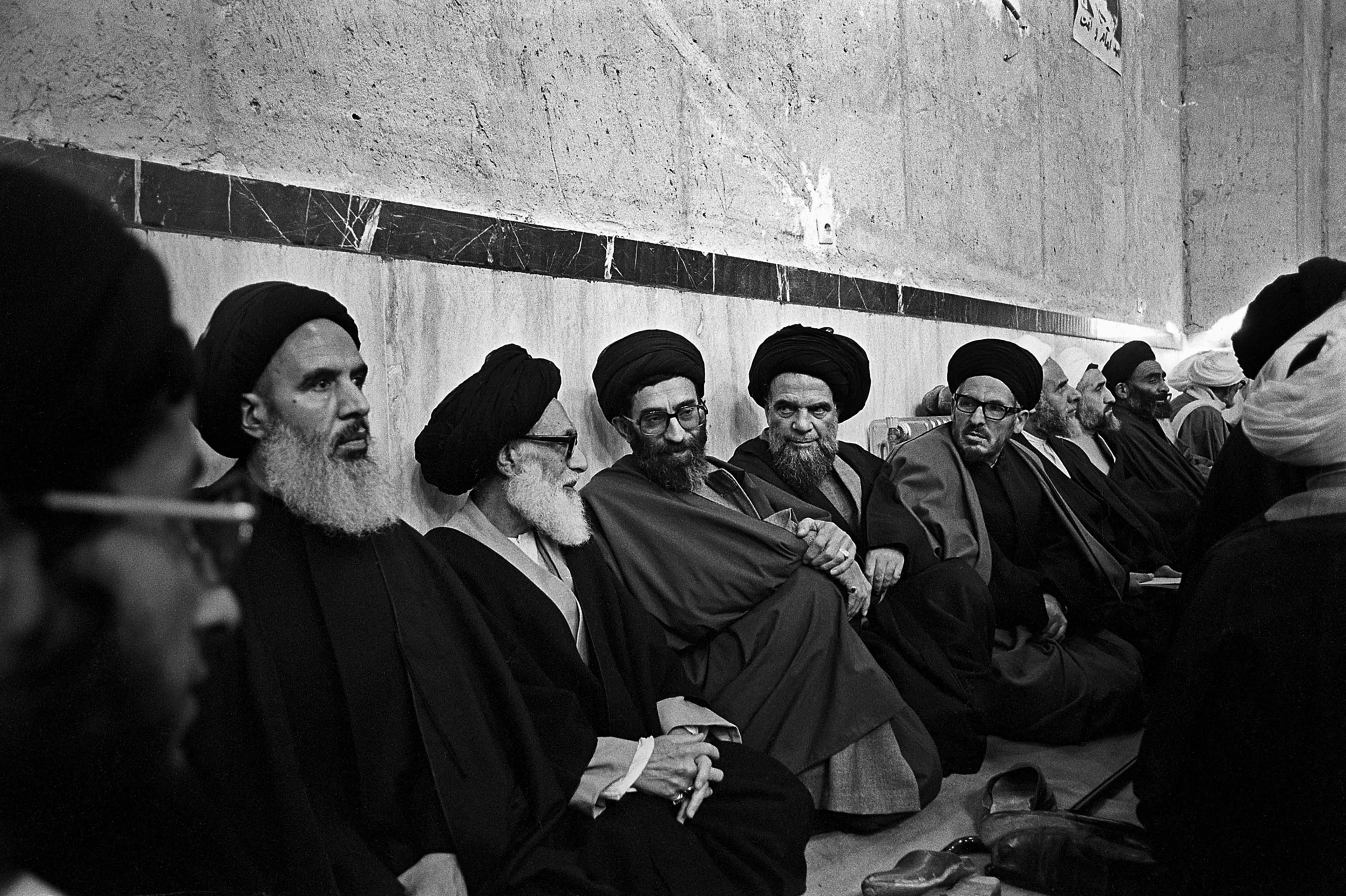 President of Iran Ali Khamenei, center, sits amongst clergymen in Jamaran mosque during an audience with Ayatollah Khomeini in Tehran, March 1982.