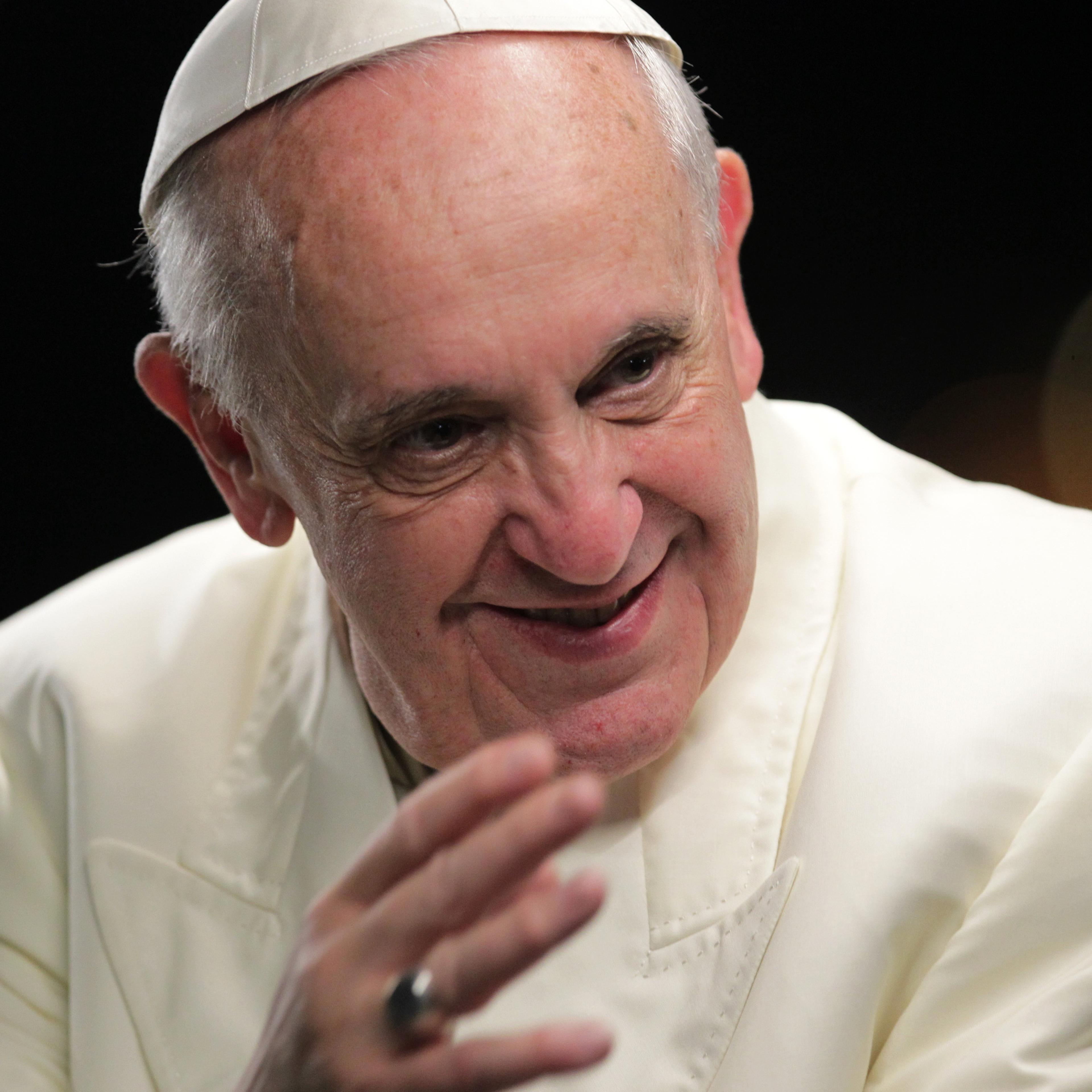 Pope Francis greets the faithful as he arrives at Copacabana Beach to celebrate mass on his sixth day in Rio de Janeiro
