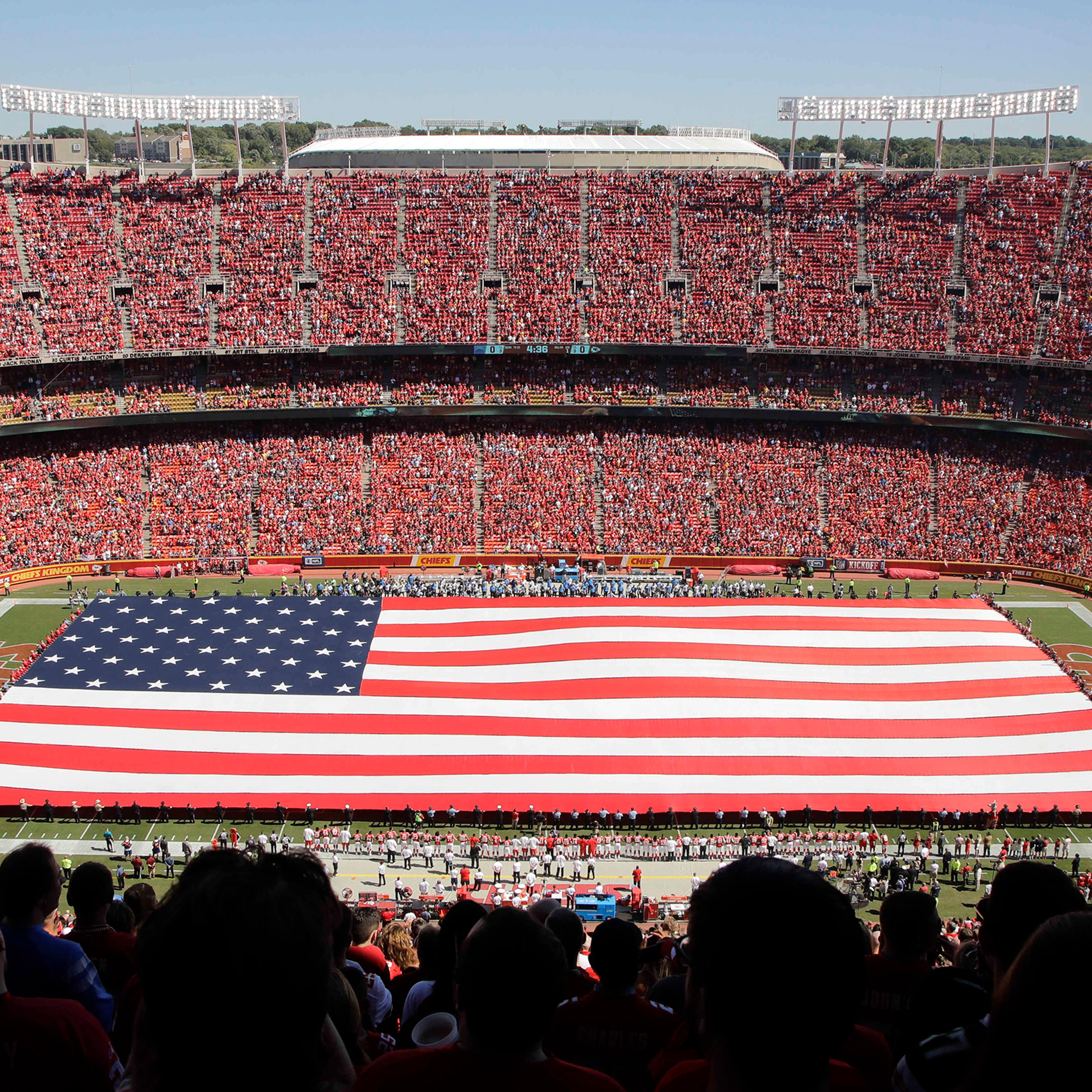 A giant flag is spread over the field at Arrowhead Stadium to commemorate Sept. 11, before an NFL football game between the Kansas City Chiefs and the San Diego Chargers in Kansas City, Missouri, Sept. 11, 2016.
