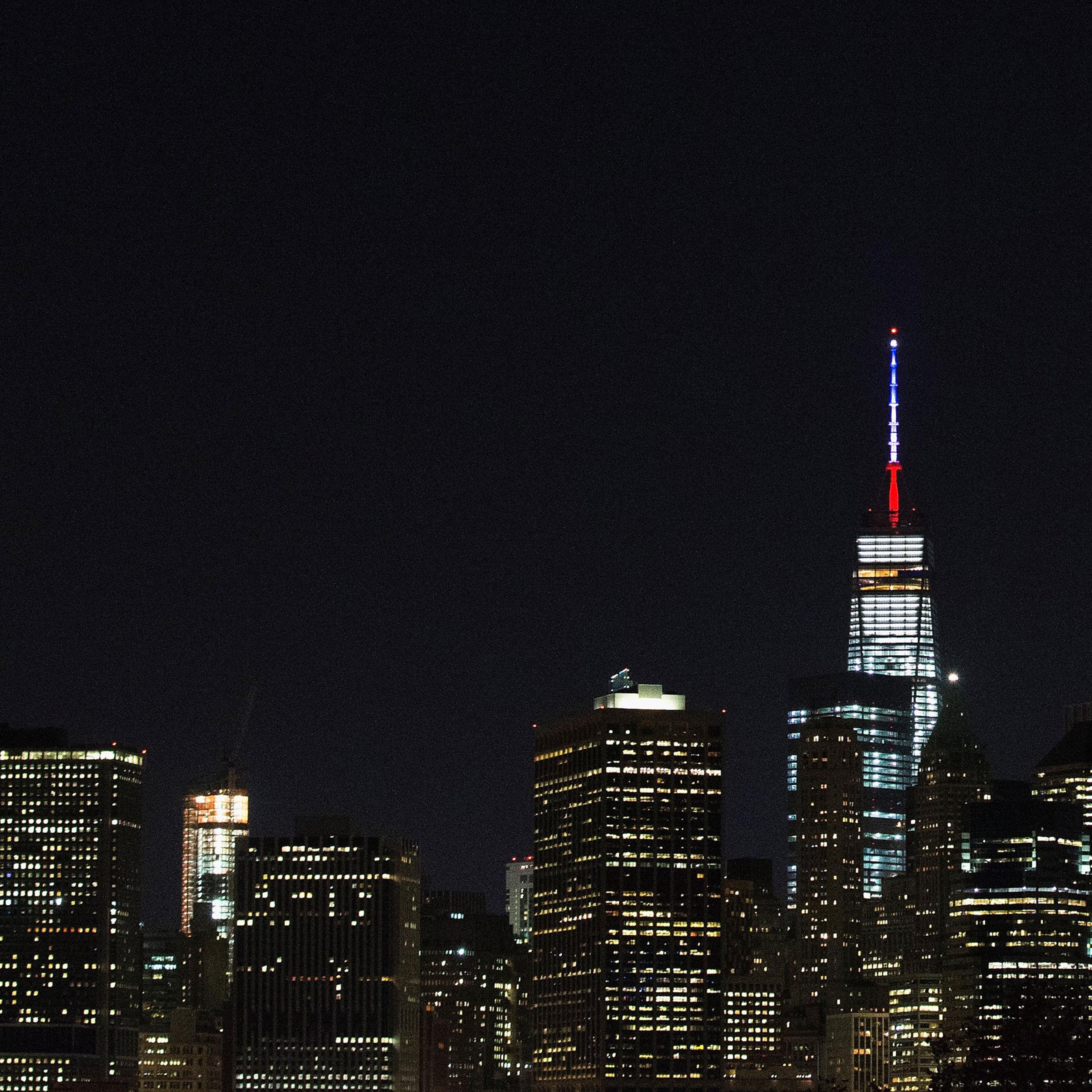 One World Trade Center's spire is lit in the colors of the French flag, white, blue and red, in solidarity with France after terror attacks in Paris on Nov. 13, 2015 in New York City.
