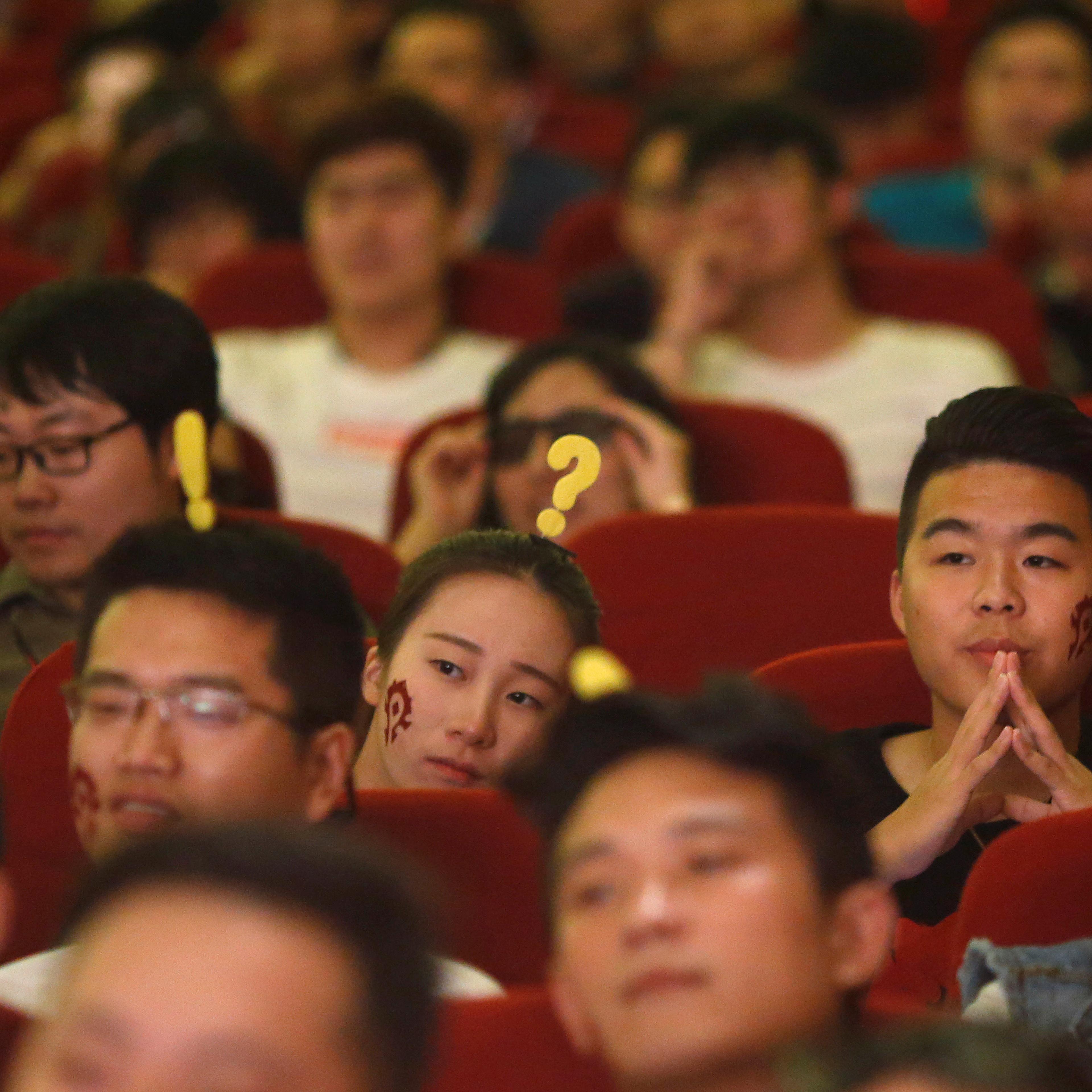 Fans attend China's premiere of the film "Warcraft" at a theatre in Shanghai