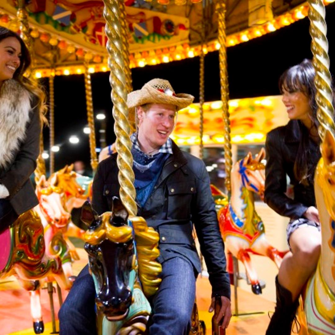 I WANNA MARRY "HARRY": Matthew Hicks (aka "Harry," C), Meghan (L) and Jacqueline (R) enjoy a carnival on the grounds of the estate in the "A Pageant for the 'Prince'" episode of I WANNA MARRY "HARRY" airing Tuesda