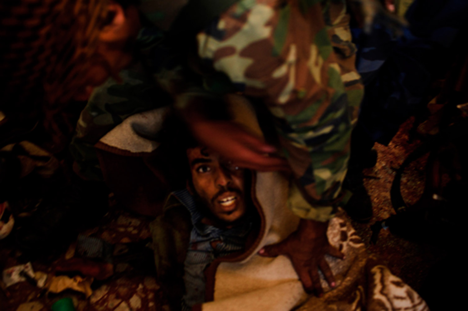 Robert Capa Gold Medal Award<br><br>Oct. 11, 2011. A mortally wounded pro-Gaddafi soldier being arrested in Sirte, Libya.