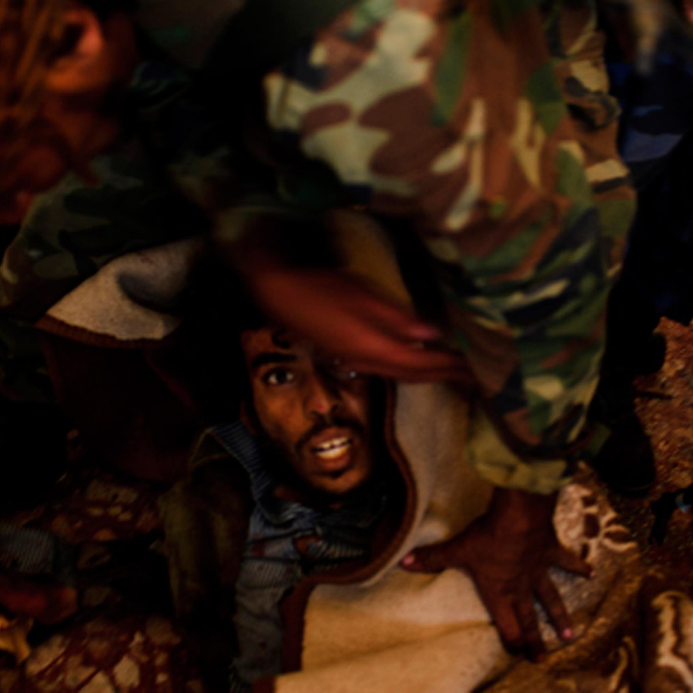 Robert Capa Gold Medal Award<br><br>Oct. 11, 2011. A mortally wounded pro-Gaddafi soldier being arrested in Sirte, Libya.