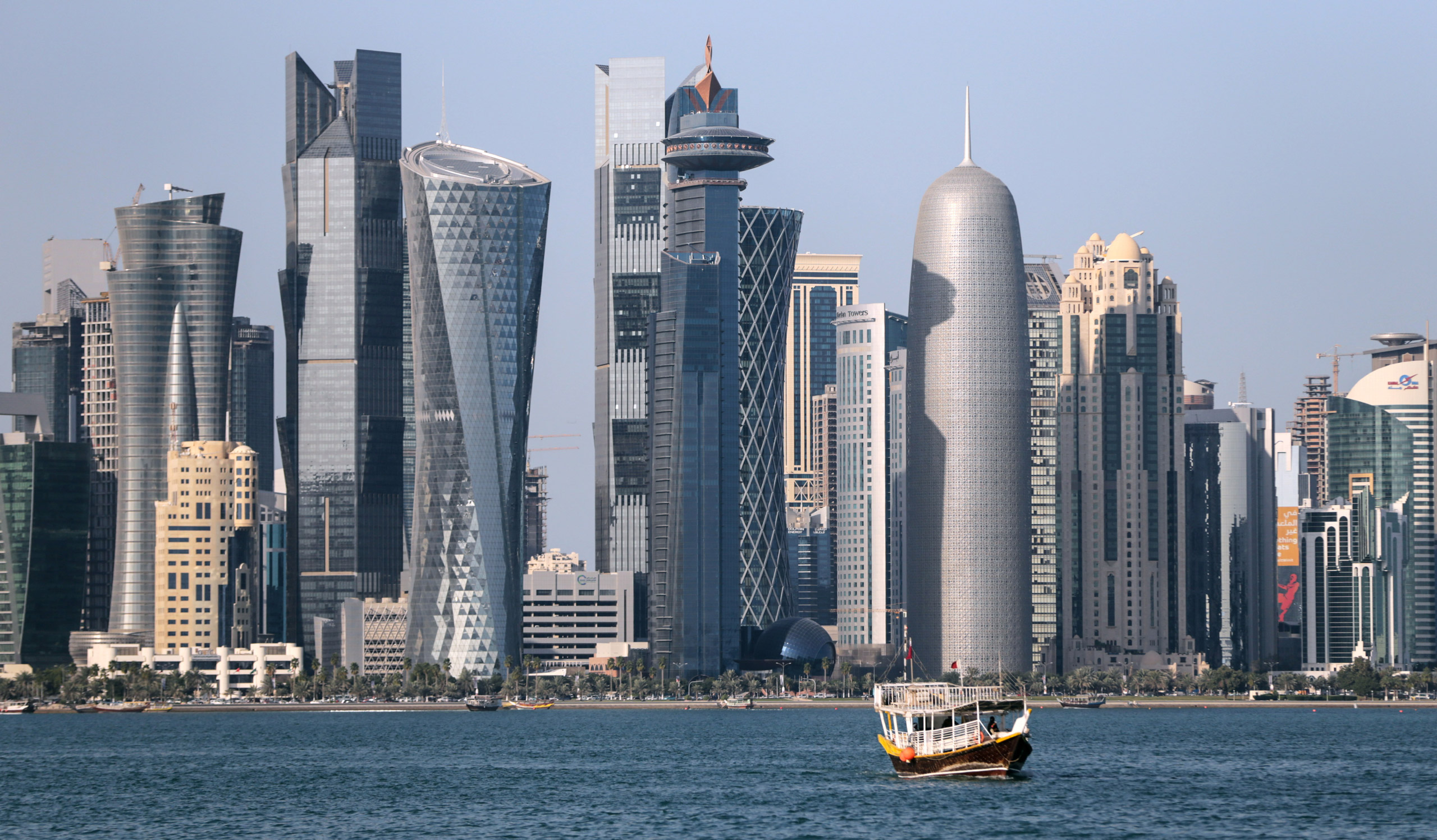 A wooden boat cruises in front of the skyline of the city of Doha, Qatar, 15 January 2015. The men's Handball World Championship takes place in Qatar from 15 January to 01 February. Photo by: Axel Heimken/picture-alliance/dpa/AP Images