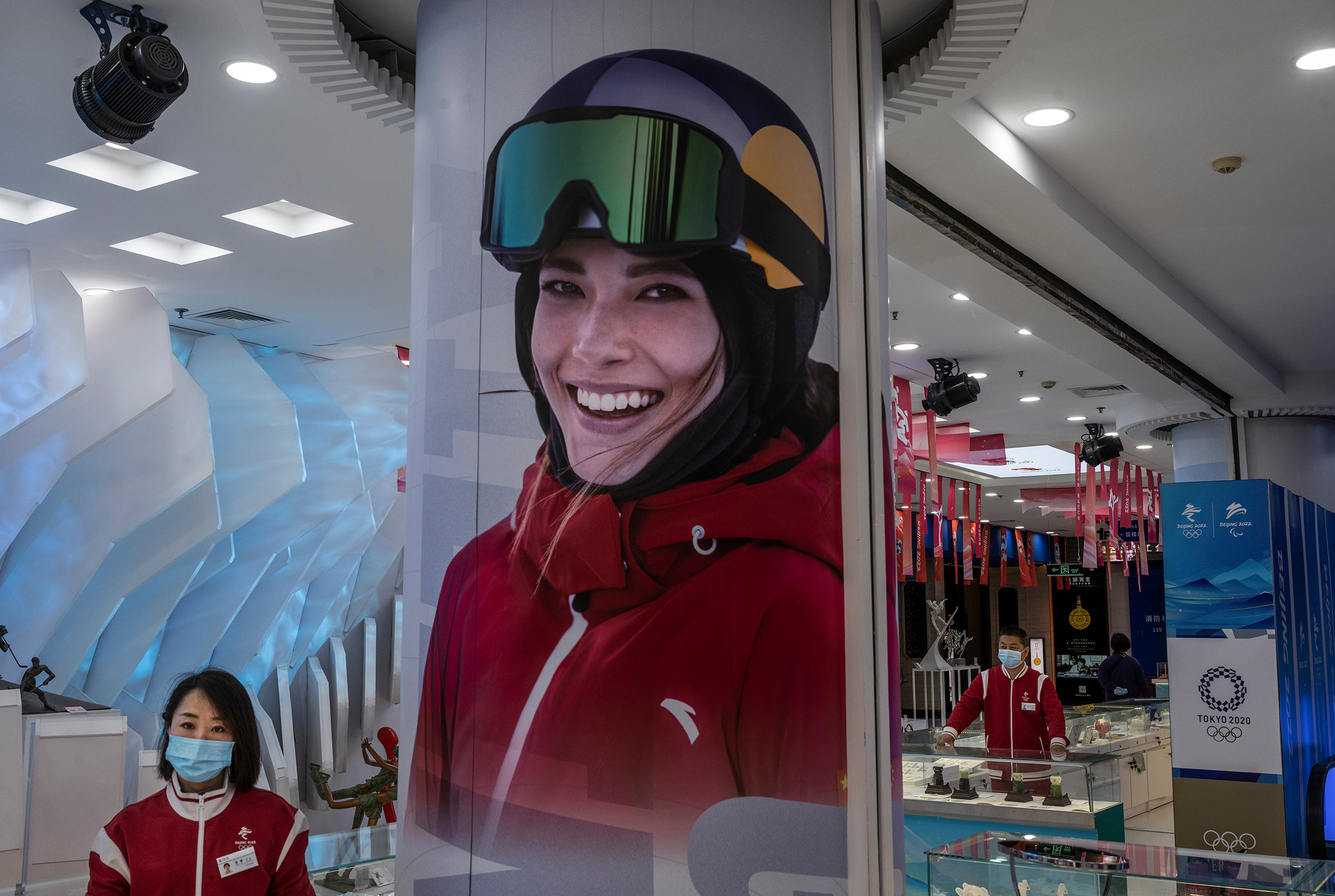 China’s “Snow Princess” beams from a poster at an Olympics merchandise store in Beijing