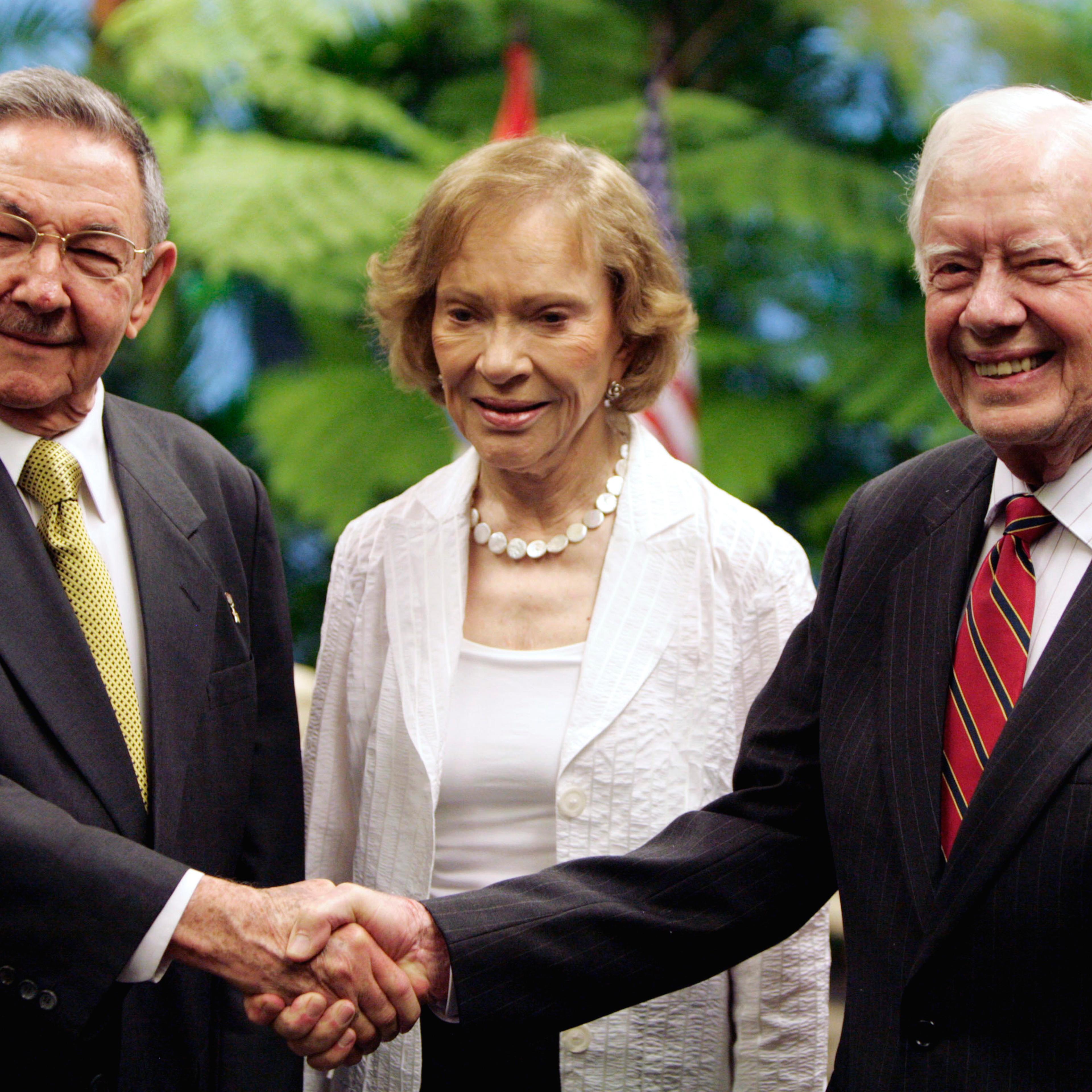 Cuba's President Raul Castro (L), former President Jimmy Carter (R) and his wife Rosalynn pose for a photo in Havana on March 29, 2011.