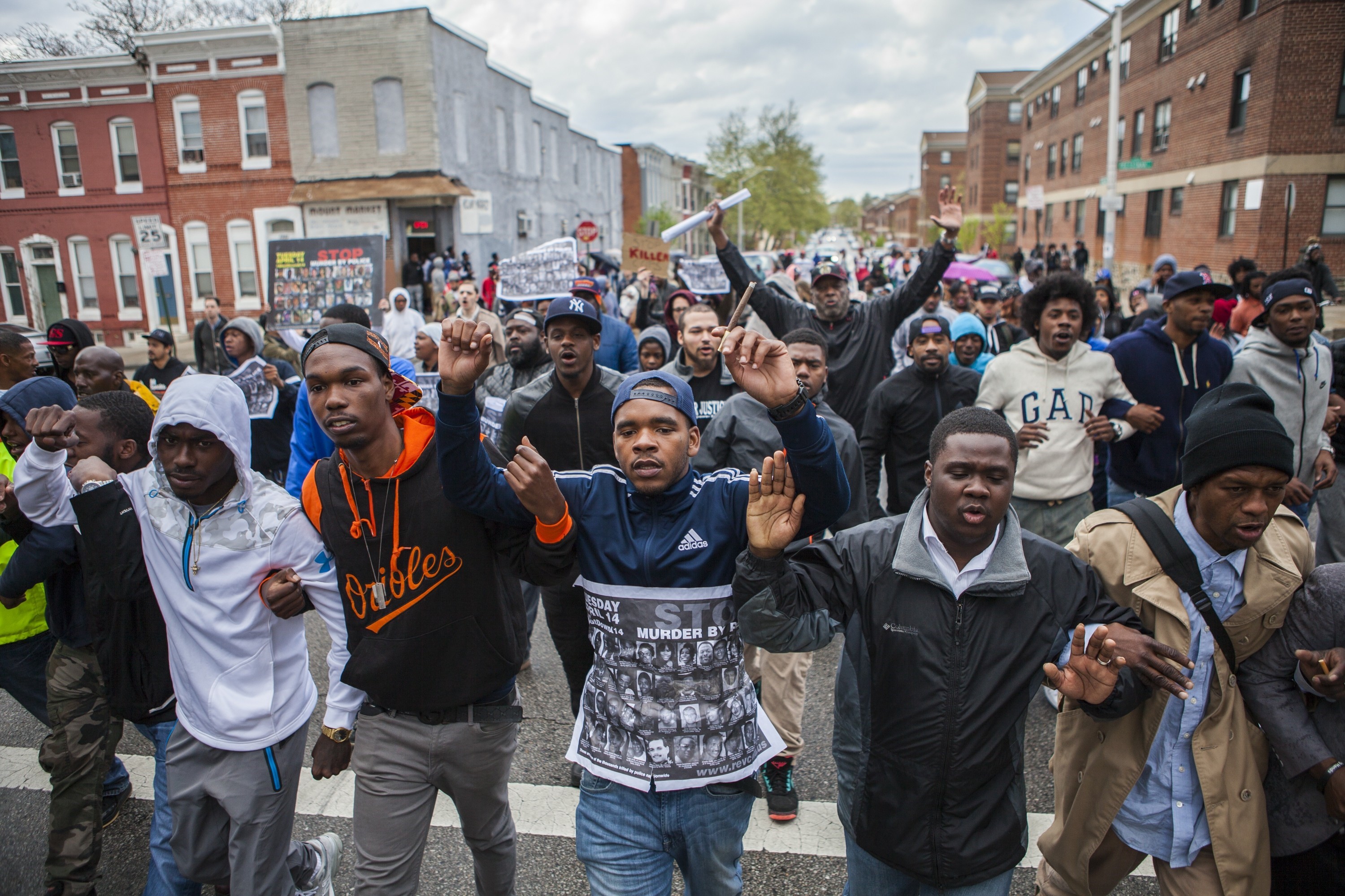 Hundreds of people march through the streets of Baltimore to seek justice for the death for Freddie Gray who died from injuries suffered in Police custody, Baltimore on April 22, 2015.