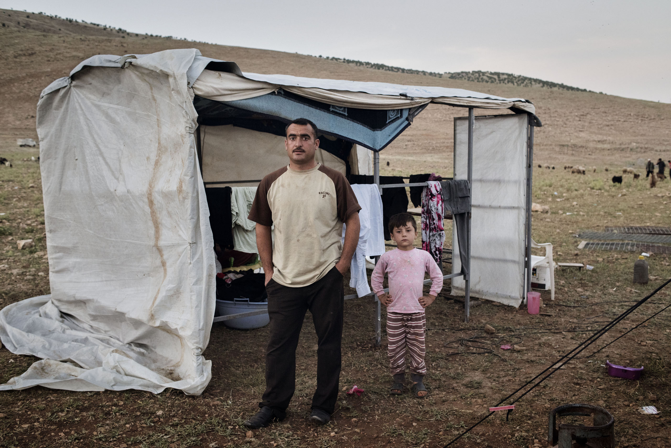 Qubad Miqdad Murad, a police officer in his thirties, stands in a camp for internally displaced people near the Iraqi town of Sinjar, May 13, 2016. Murad returned to Sinjar after Kurdish forces recaptured it from ISIS in November 2015, but he since decid