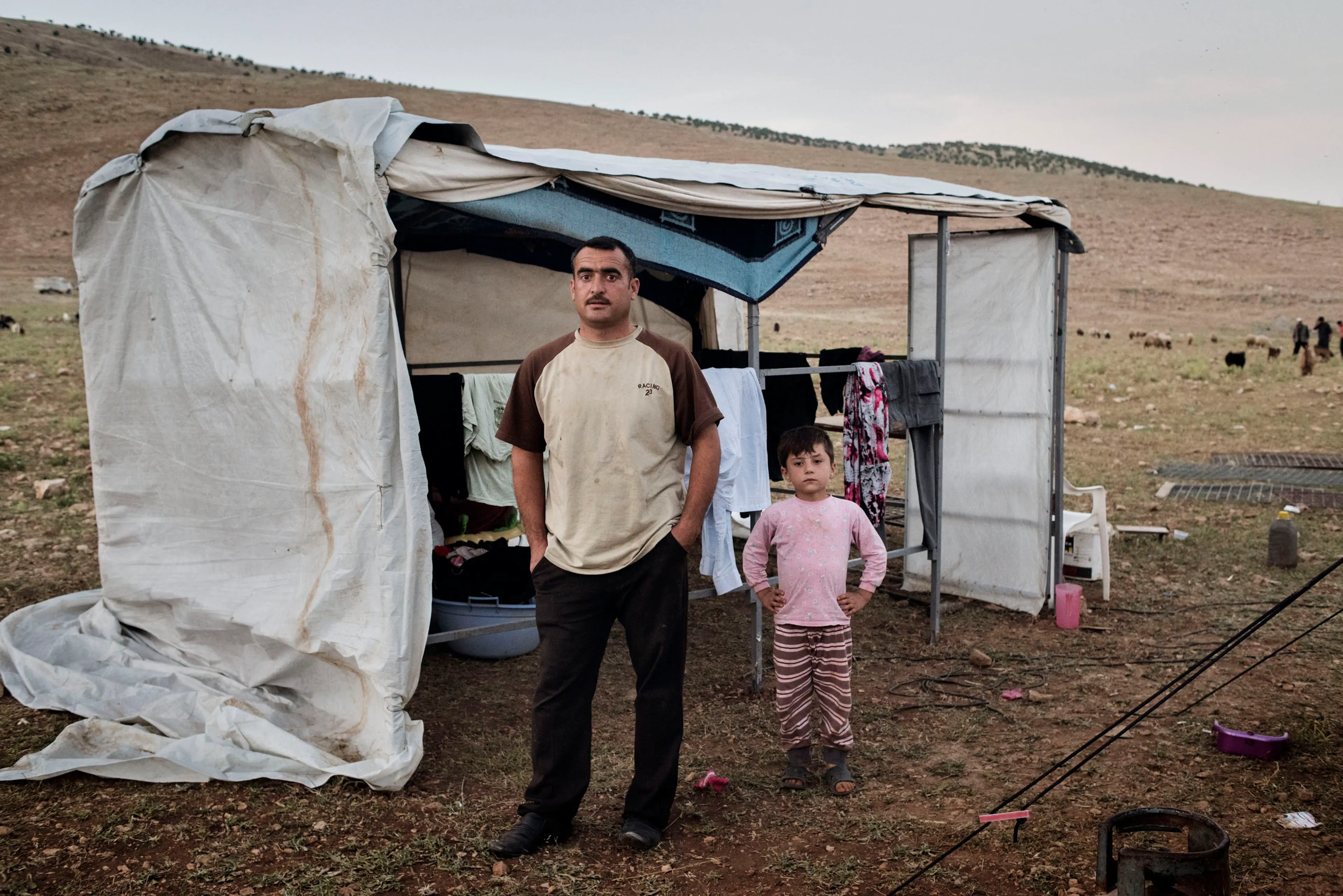 Qubad Miqdad Murad, a police officer in his thirties, stands in a camp for internally displaced people near the Iraqi town of Sinjar, May 13, 2016. Murad returned to Sinjar after Kurdish forces recaptured it from ISIS in November 2015, but he since decid