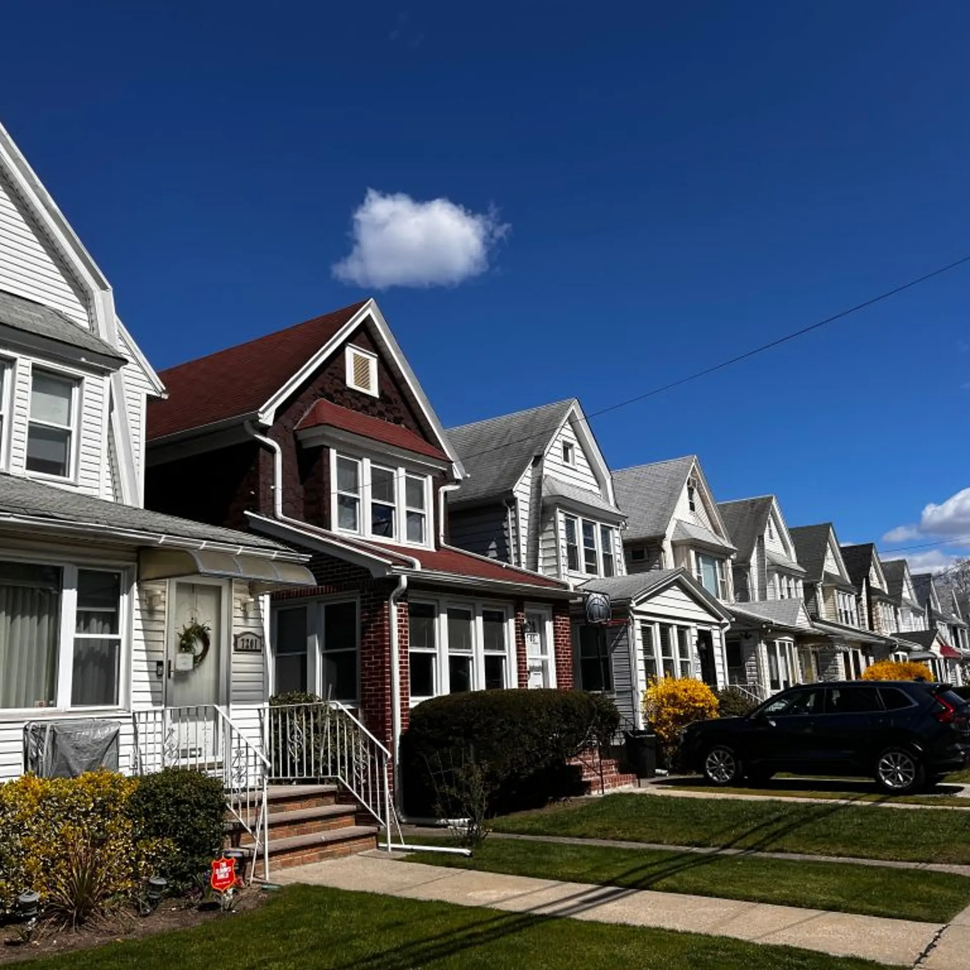 Row of identical houses and yards in Queens, New York