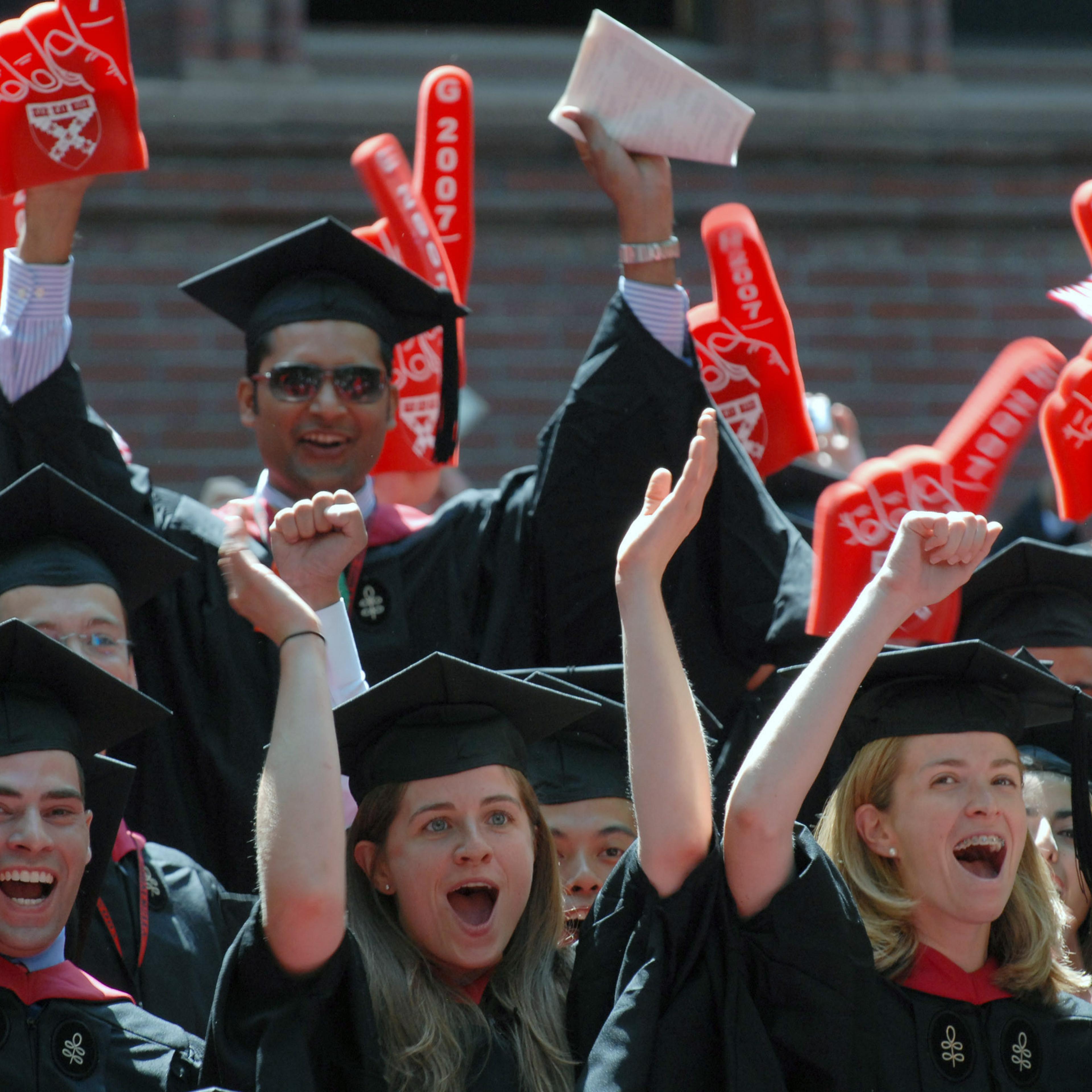 Harvard Business School students cheer as their MBA degrees