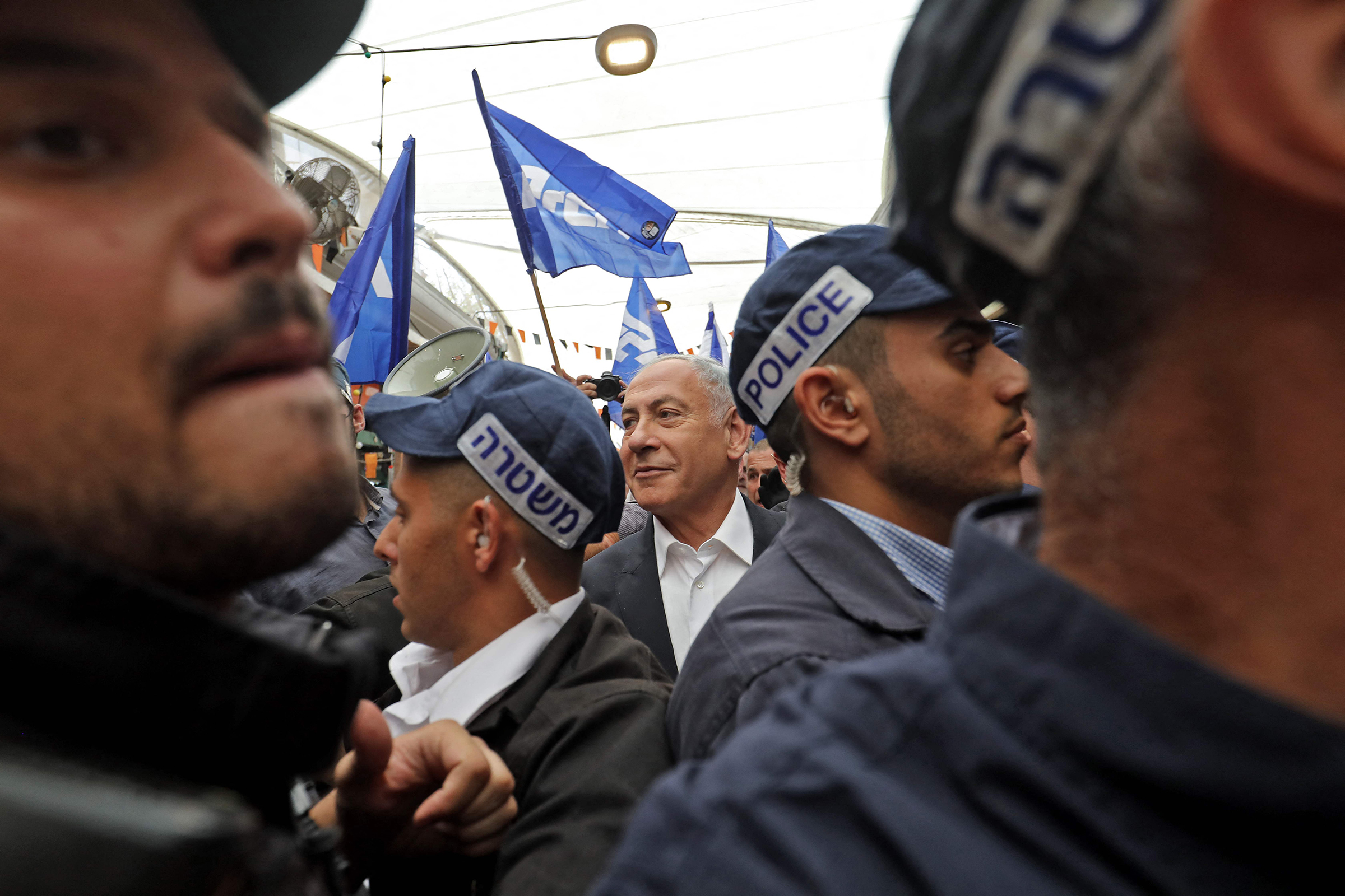 Former Israeli Prime Minister Benjamin Netanyahu visits the Tikva market in Tel Aviv on Oct. 28 ahead of the November general elections. 