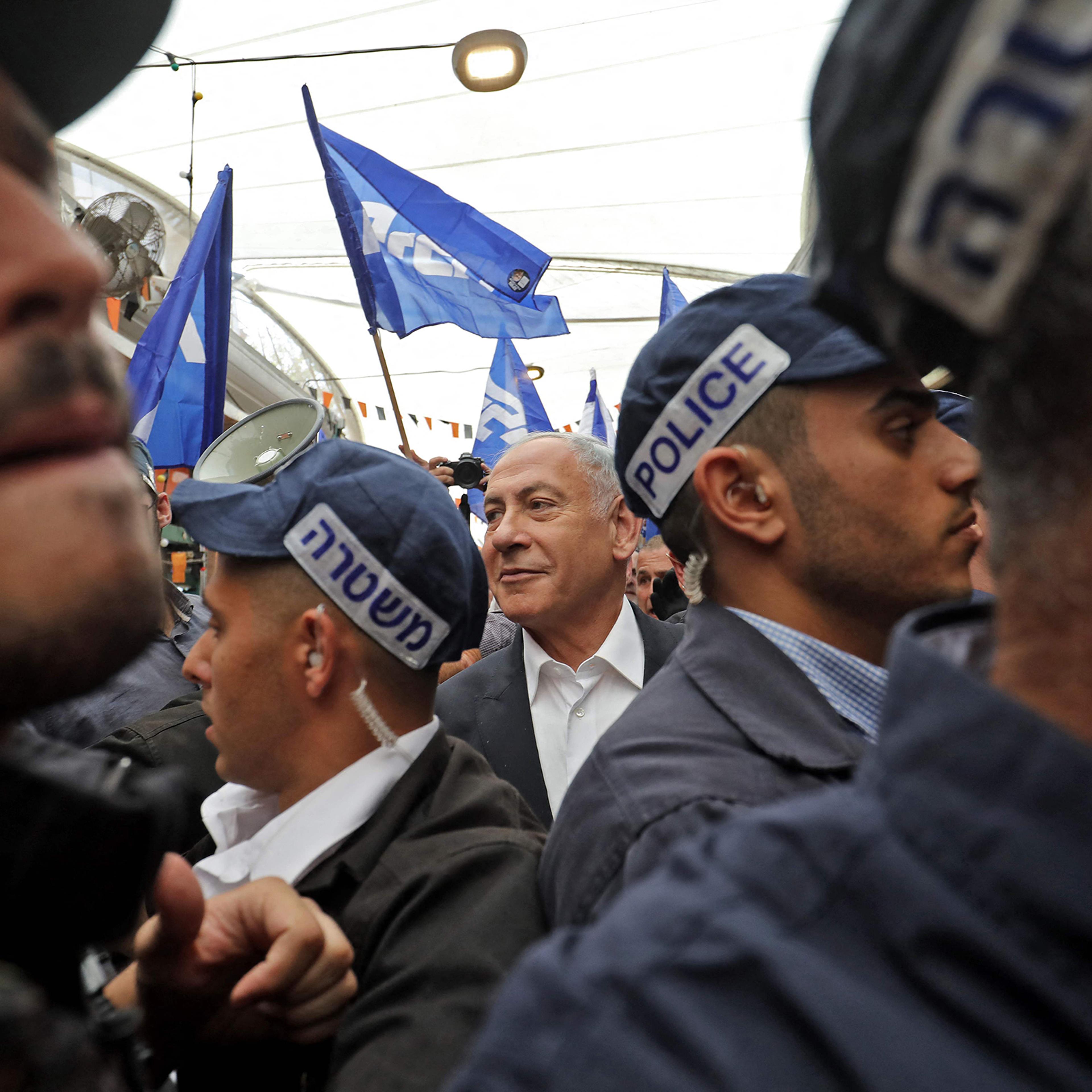 Former Israeli Prime Minister Benjamin Netanyahu visits the Tikva market in Tel Aviv on Oct. 28 ahead of the November general elections.