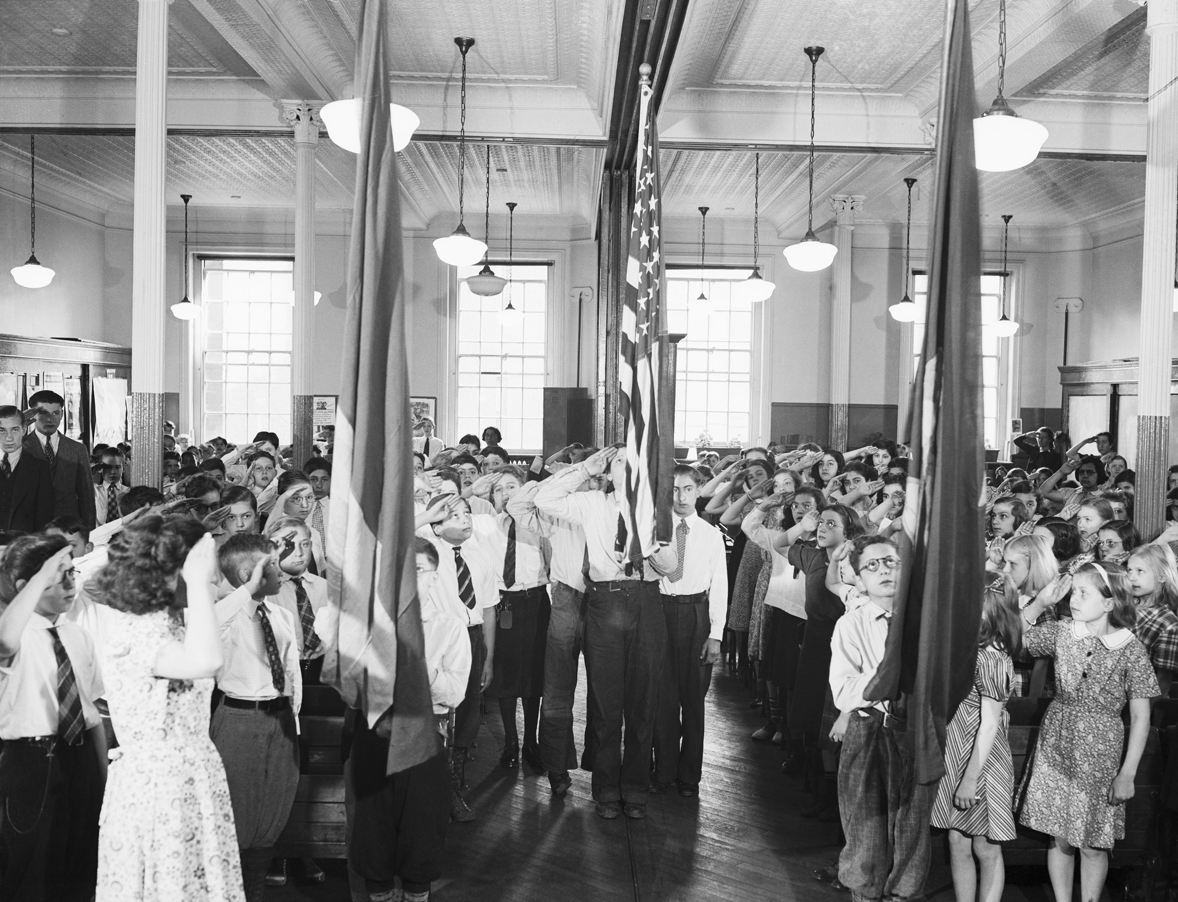 Students at P.S. #73 reciting the 'Pledge of Allegiance' on Jun. 1, 1938, in New York, N.Y.