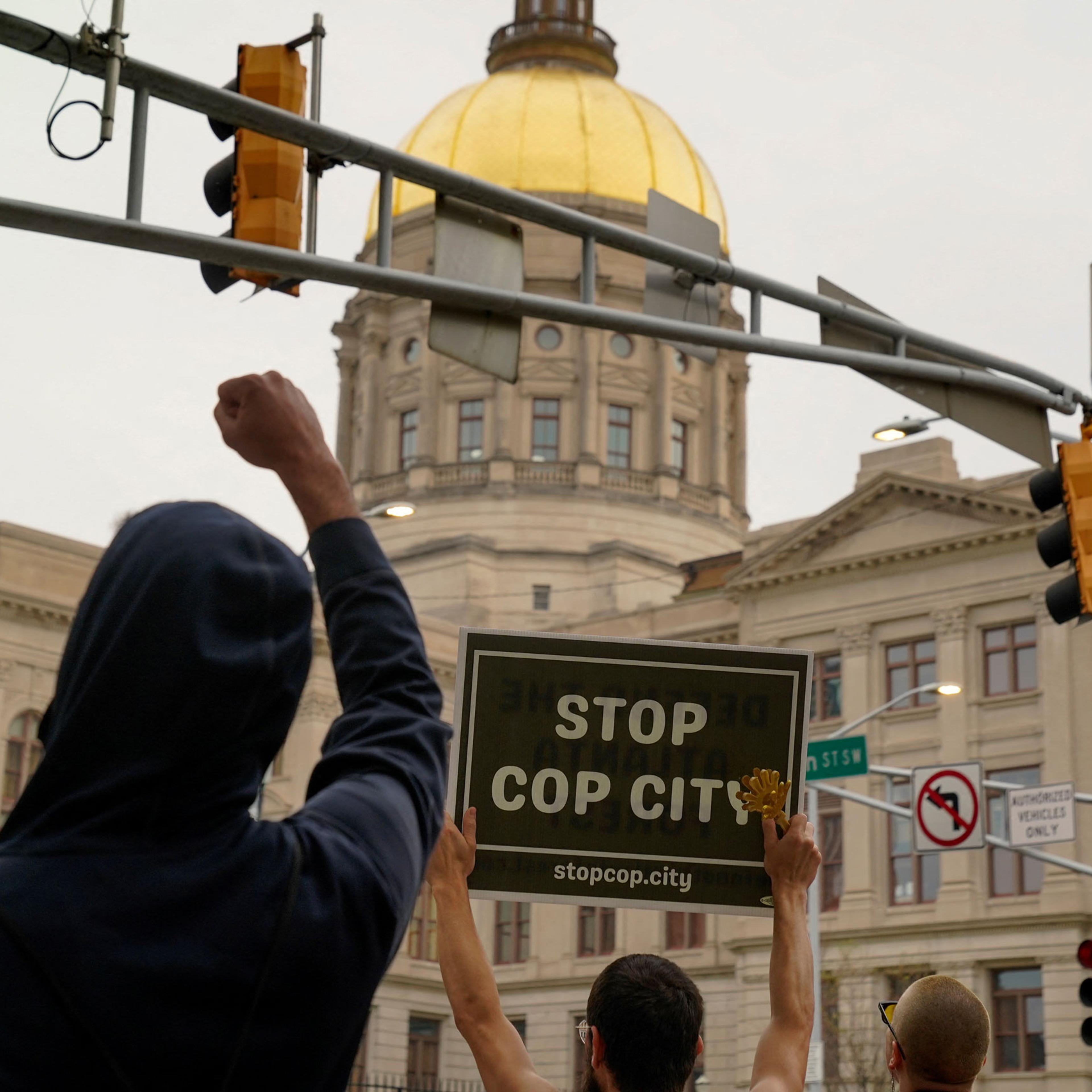 People protest agains the controversial “Cop City” project as the clear cutting of trees begins near Atlanta