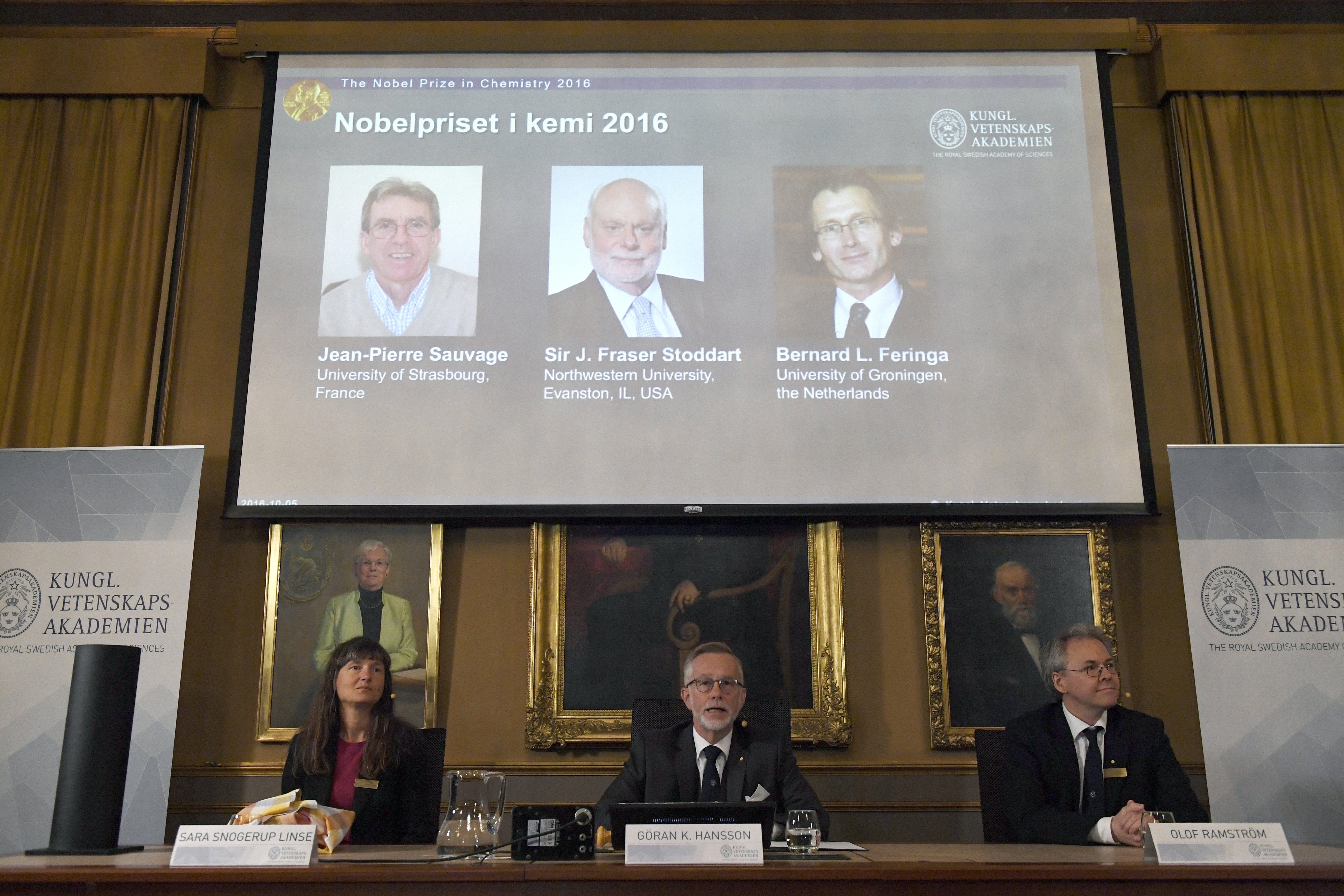 The Royal Academy of Sciences members, from left to right, Professor Sara Snogerup Linse, Professor Goran K Hansson and Professor Olof Ramstrom present the 2016 Nobel Chemistry Prize at the Royal Swedish Academy of Sciences, in Stockholm, Sweden, Wednesd