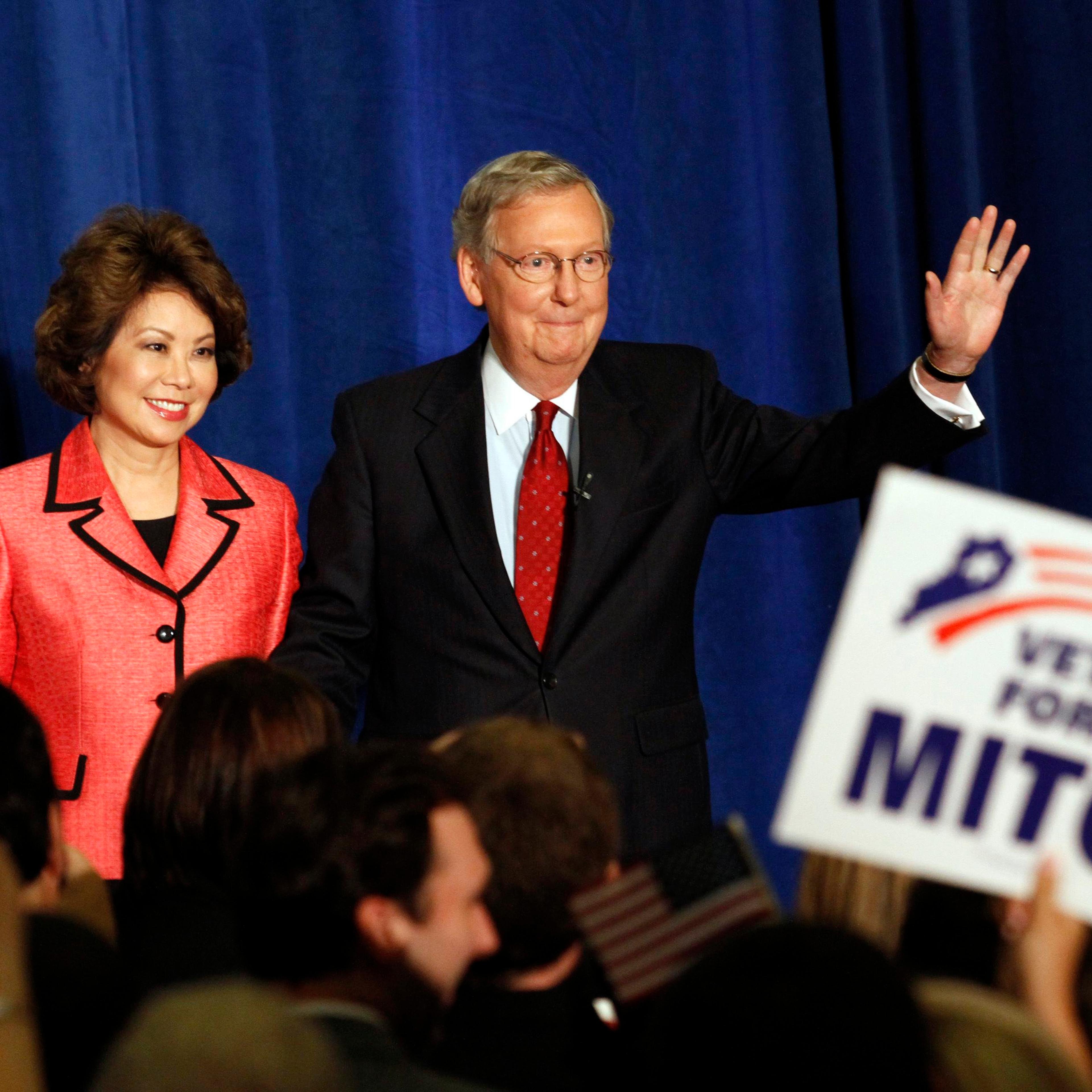Senate Republican Leader Sen. Mitch McConnell and his wife Elaine Chao greet a crowd of campaign supporters after defeating Tea Party challenger Matt Bevin in the state Republican primary elections in Louisville, Ky., May 20, 2014.