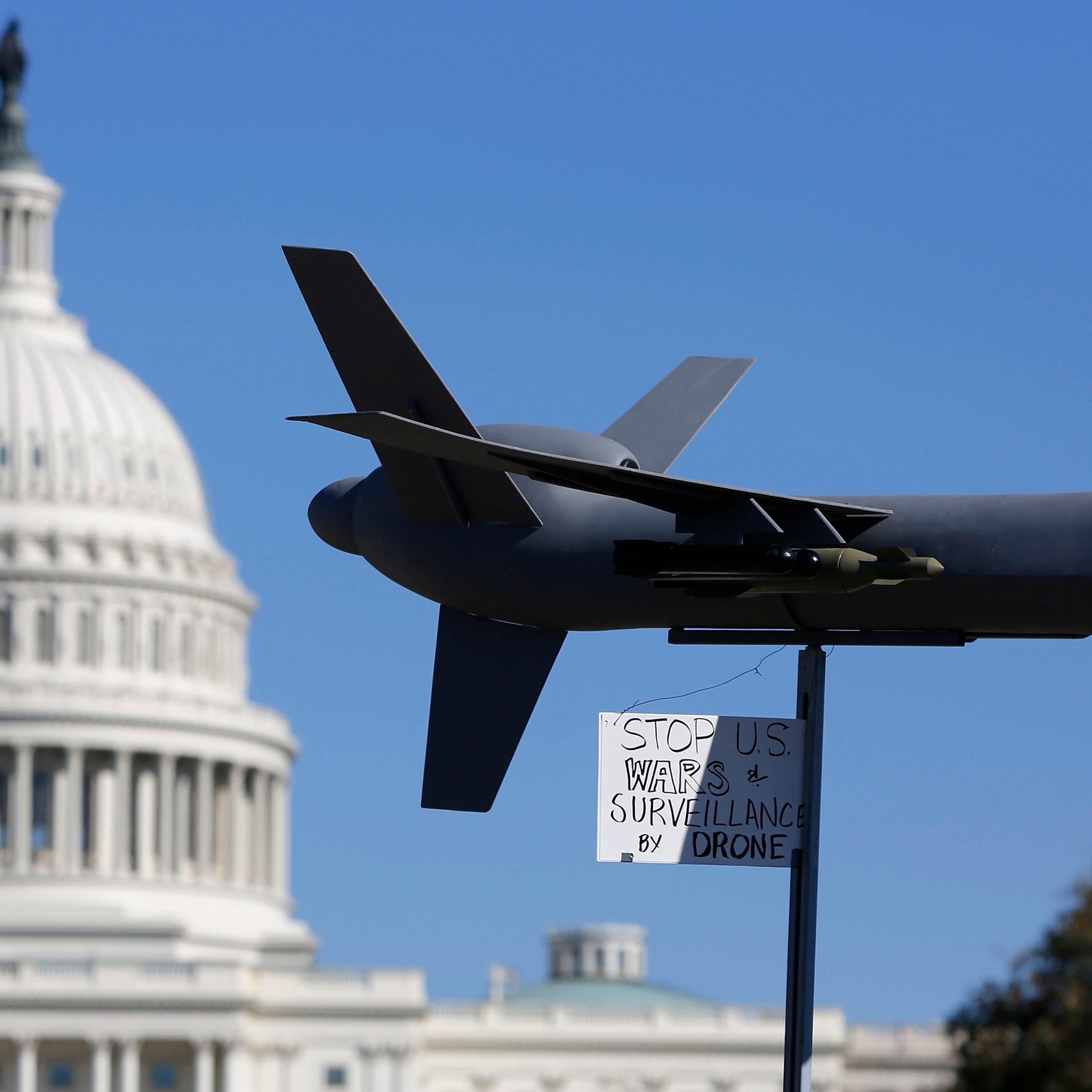 Demonstrators deploy model of U.S. drone aircraft at "Stop Watching Us: A Rally Against Mass Surveillance" near U.S. Capitol in Washington