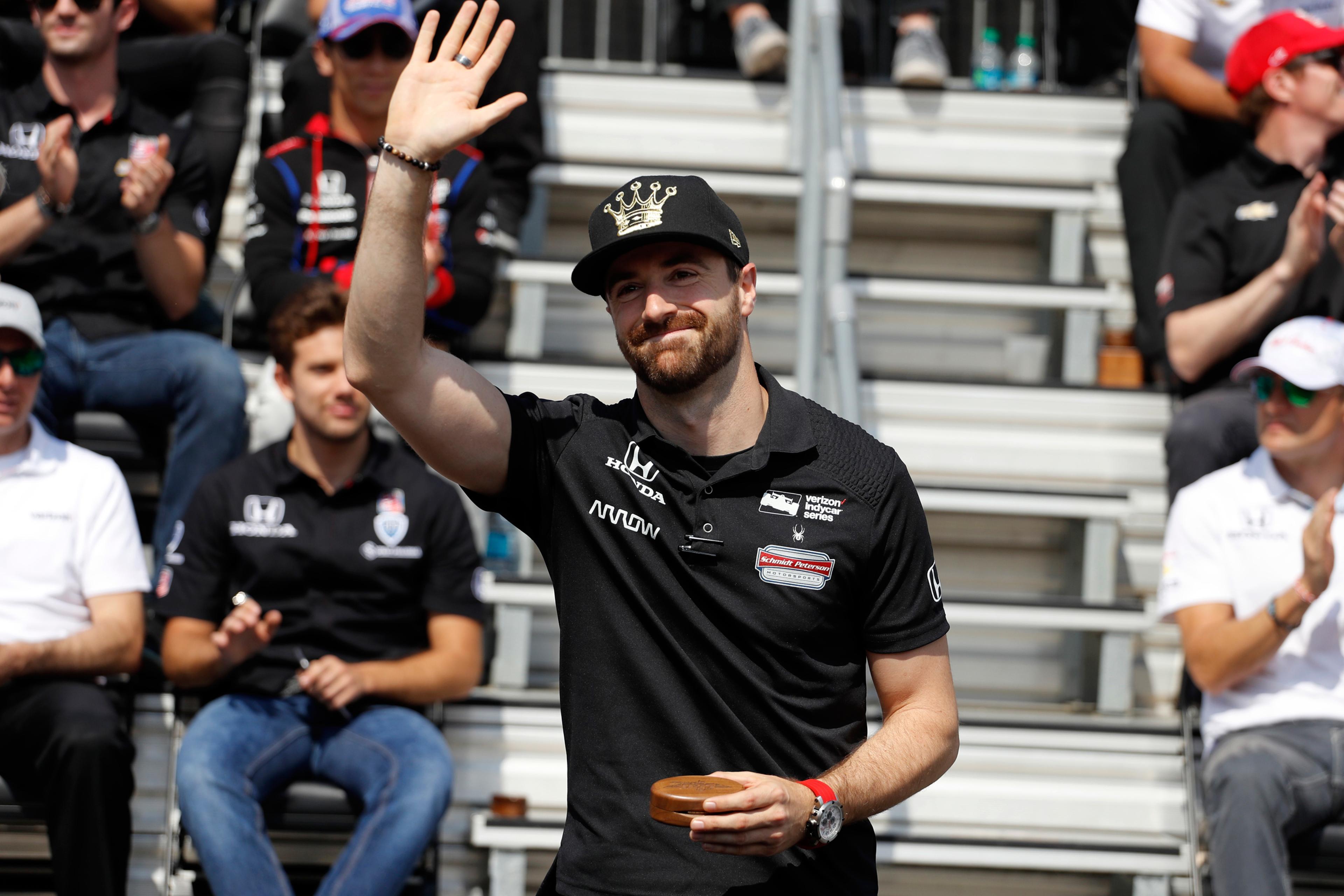 Pole sitter James Hinchcliffe, of Canada, waves to fans during the drivers meeting for the Indianapolis 500 auto race at Indianapolis Motor Speedway in Indianapolis, Saturday, May 28, 2016. (AP Photo/Jeff Roberson)