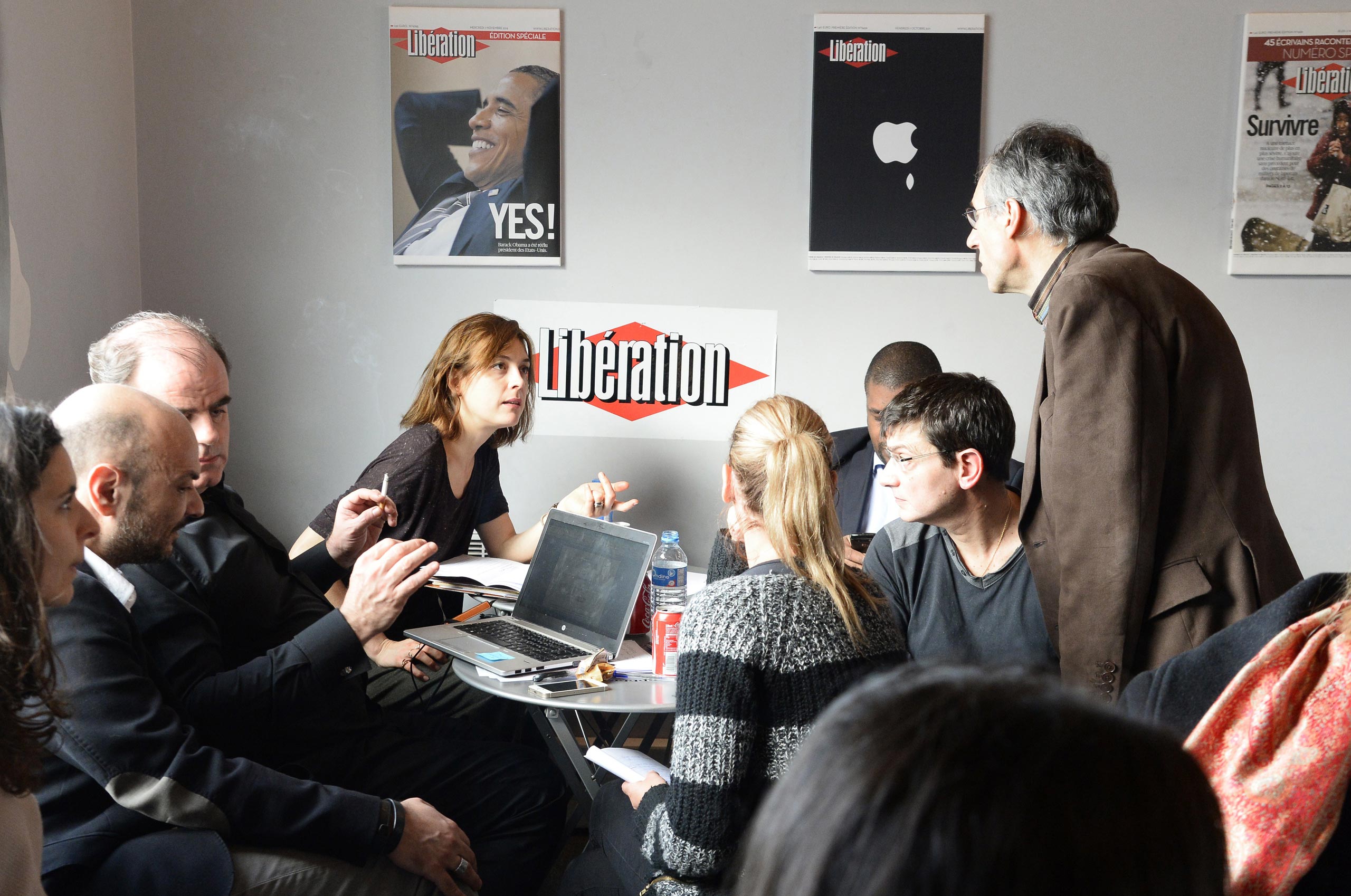 Editor-in-chief of French satirical weekly Charlie Hebdo Gerard Briard (R), lawyer Richard Malka (L) and financial director Eric Portheault gather at the headquarters of French newspaper Liberation on Jan. 9, 2015 in Paris as editorial staff of the Frenc