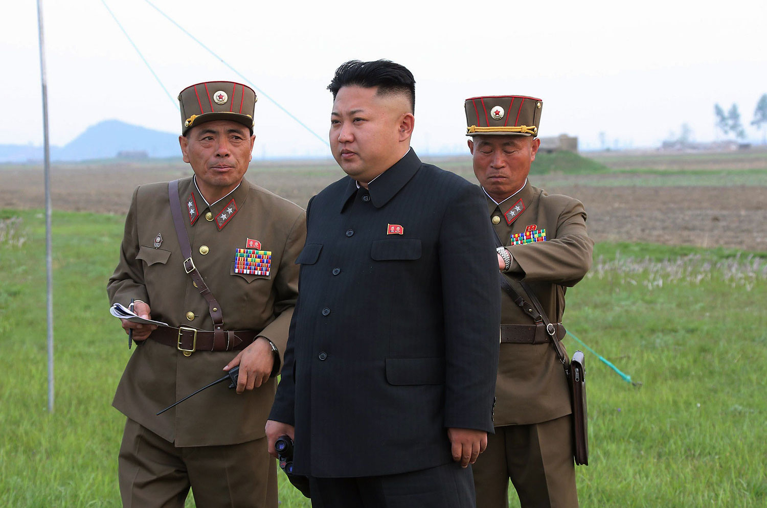 Undated picture released from North Korea's official Korean Central News Agency on April 26, 2014 shows North Korean leader Kim Jong-Un inspecting a shelling drill of an artillery sub-unit under Korean People's Army Unit 681 at undisclosed place in North