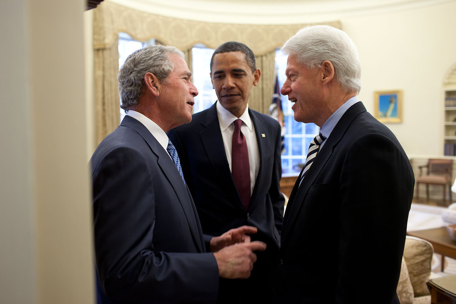 “President Obama had called on the two former Presidents to help with the situation in Haiti. During their public remarks in the Rose Garden, Jan. 16, 2010, President Clinton had said about President Bush, ‘I’ve already figured out how I can get him to do some things that he didn’t sign on for.’ Later, back in the Oval, President Bush is jokingly asking President Clinton what were those things he had in mind.”