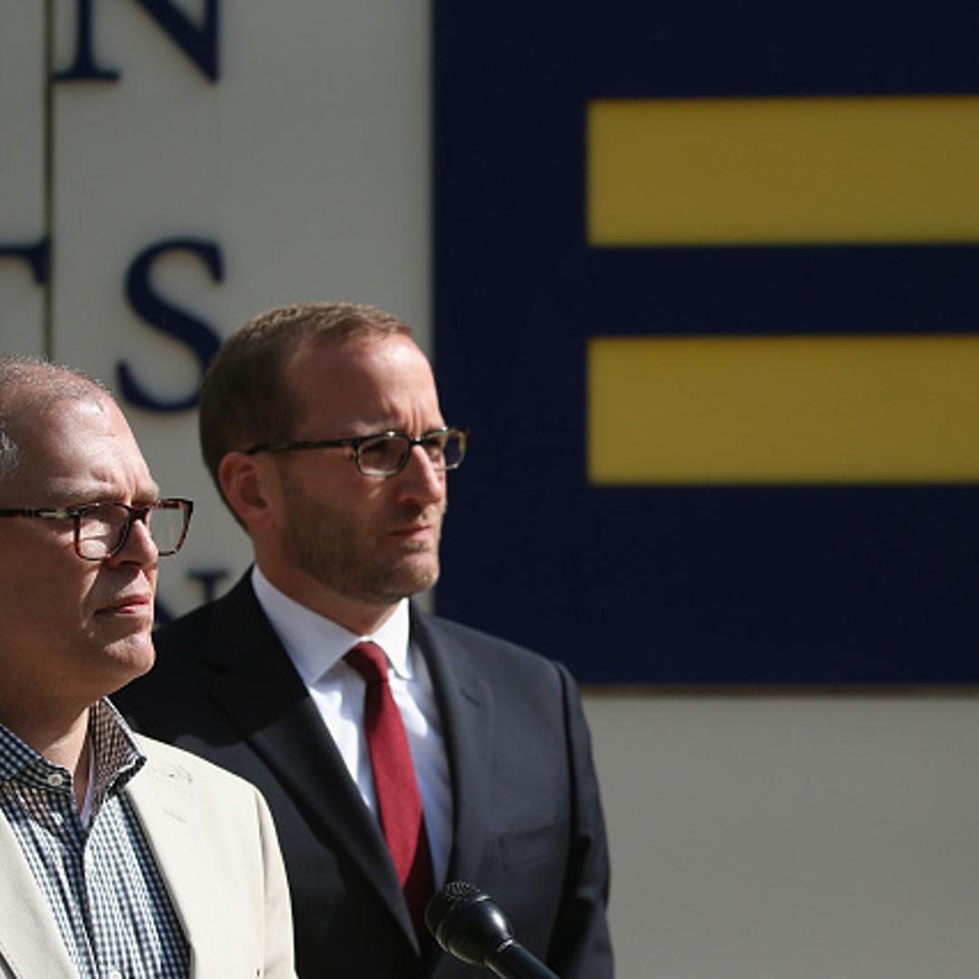 Plaintiff James Obergefell (L) is flanked by Human Rights Campaign President Chad Griffin (R), speaks about his case before tomorrow's arguments at the US Supreme Court April 27, 2015 in Washington, DC.