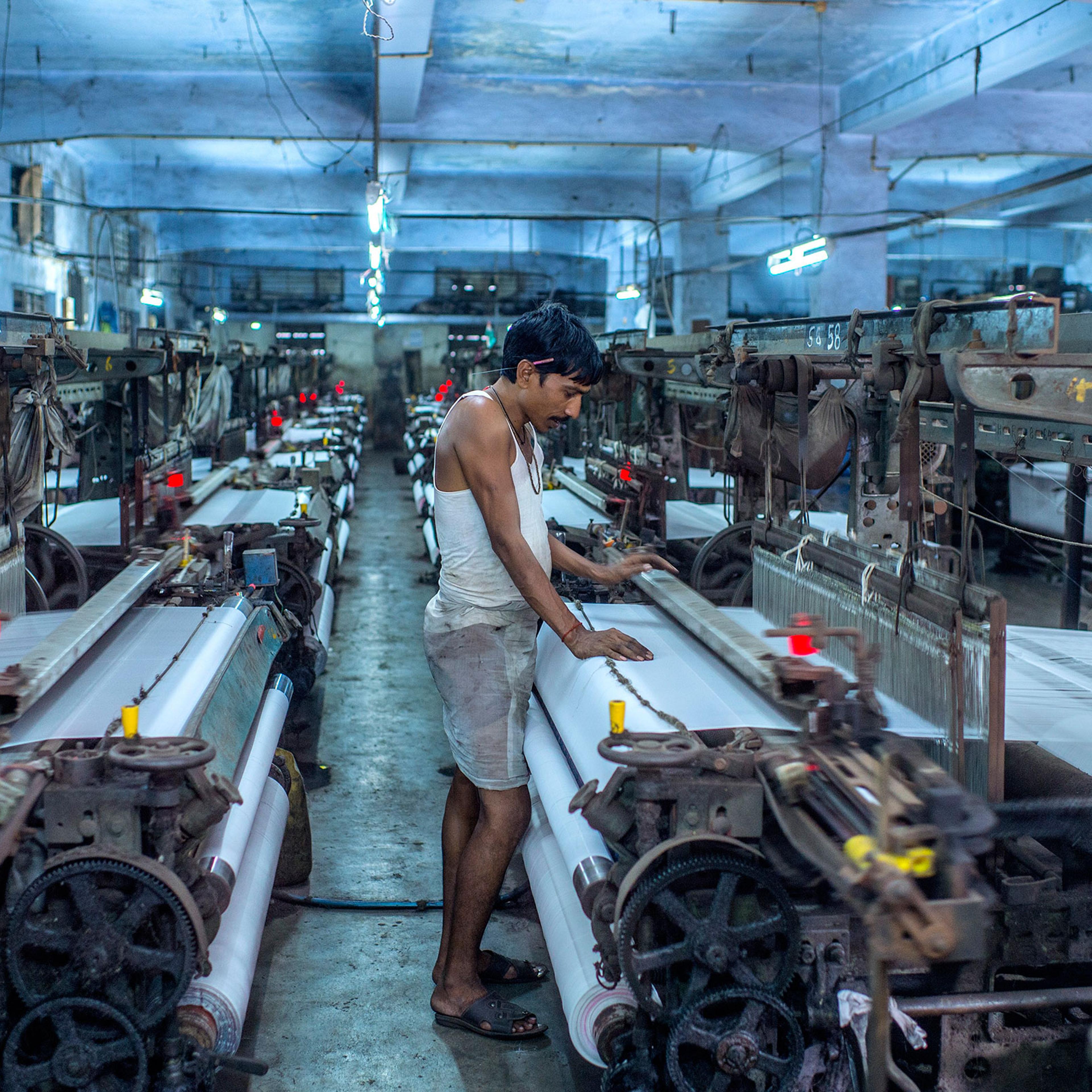 Umakant Sharma works the looms in Surat, India