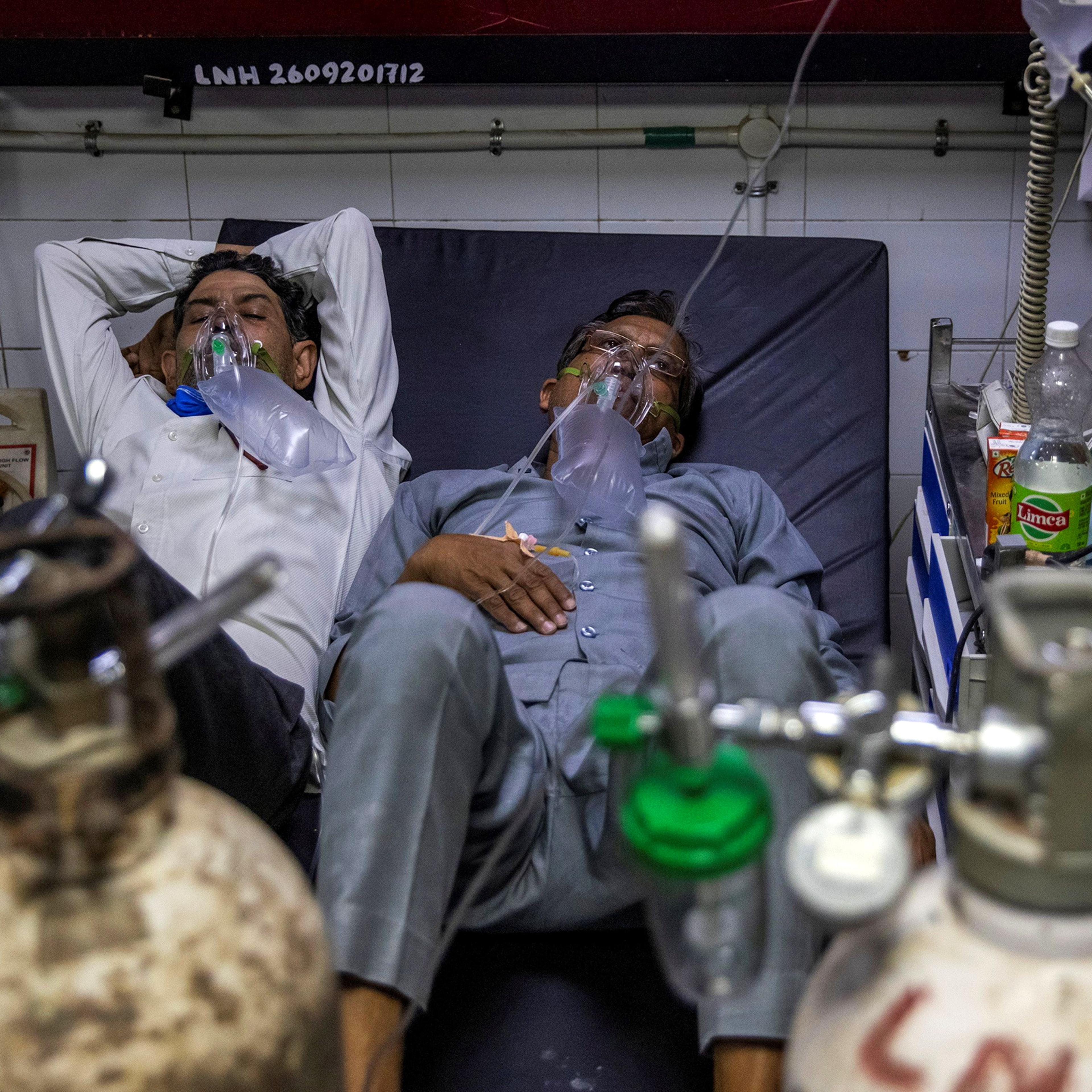 Patients suffering from COVID-19 receive treatment in the casualty ward of a New Delhi hospital on April 15, 2021.