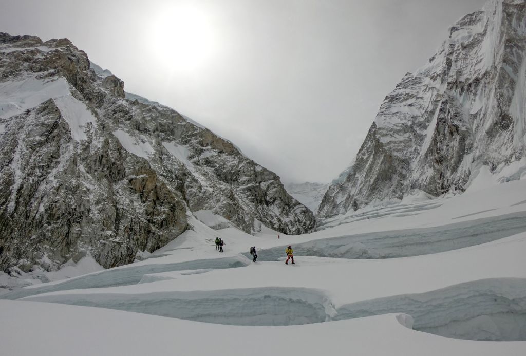 Mountaineers walk near camp two of Mount Everest, as they prepare to ascend on the south face from Nepal