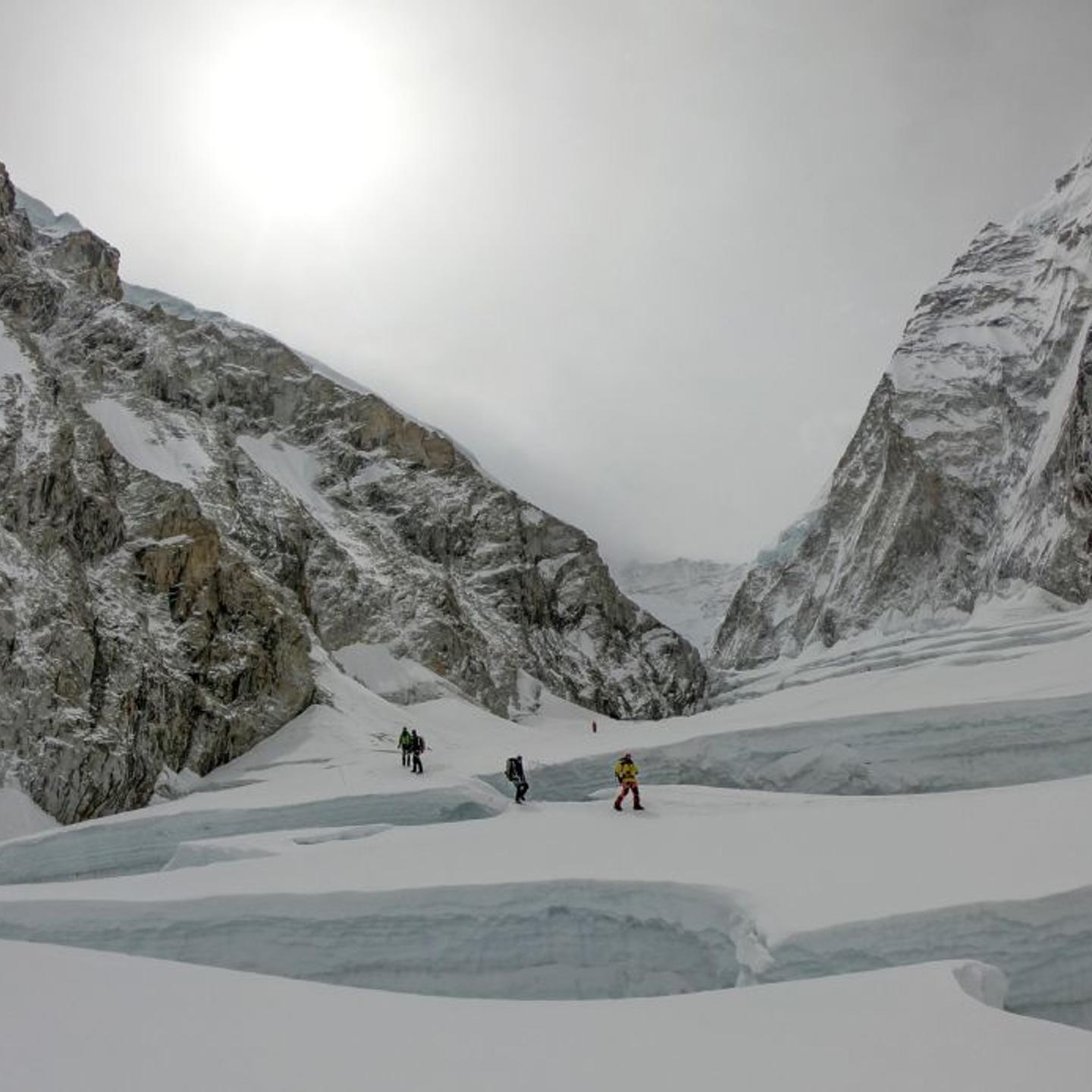 Mountaineers walk near camp two of Mount Everest, as they prepare to ascend on the south face from Nepal