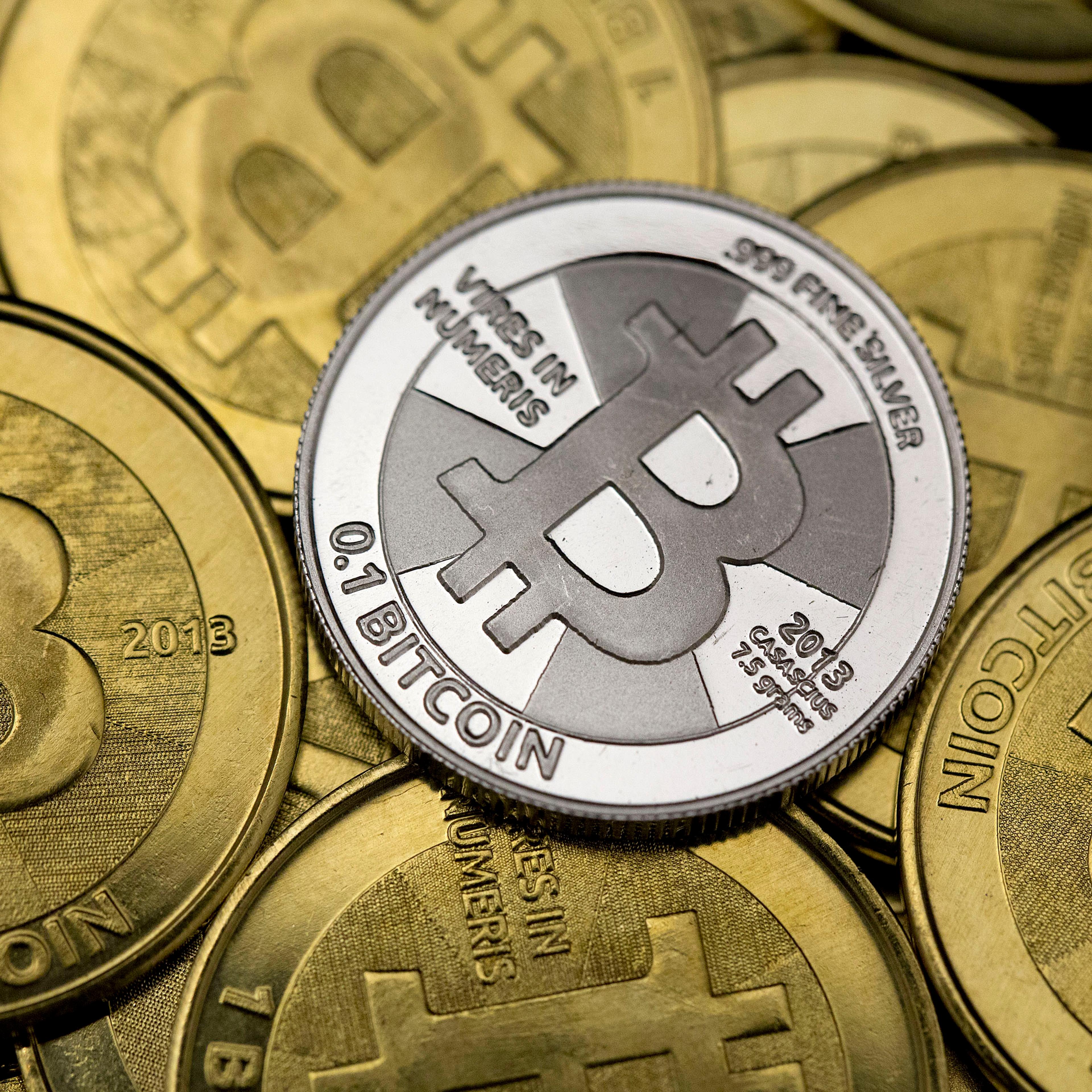 Some of Bitcoin enthusiast Mike Caldwell's coins are pictured at his office in this photo illustration in Sandy