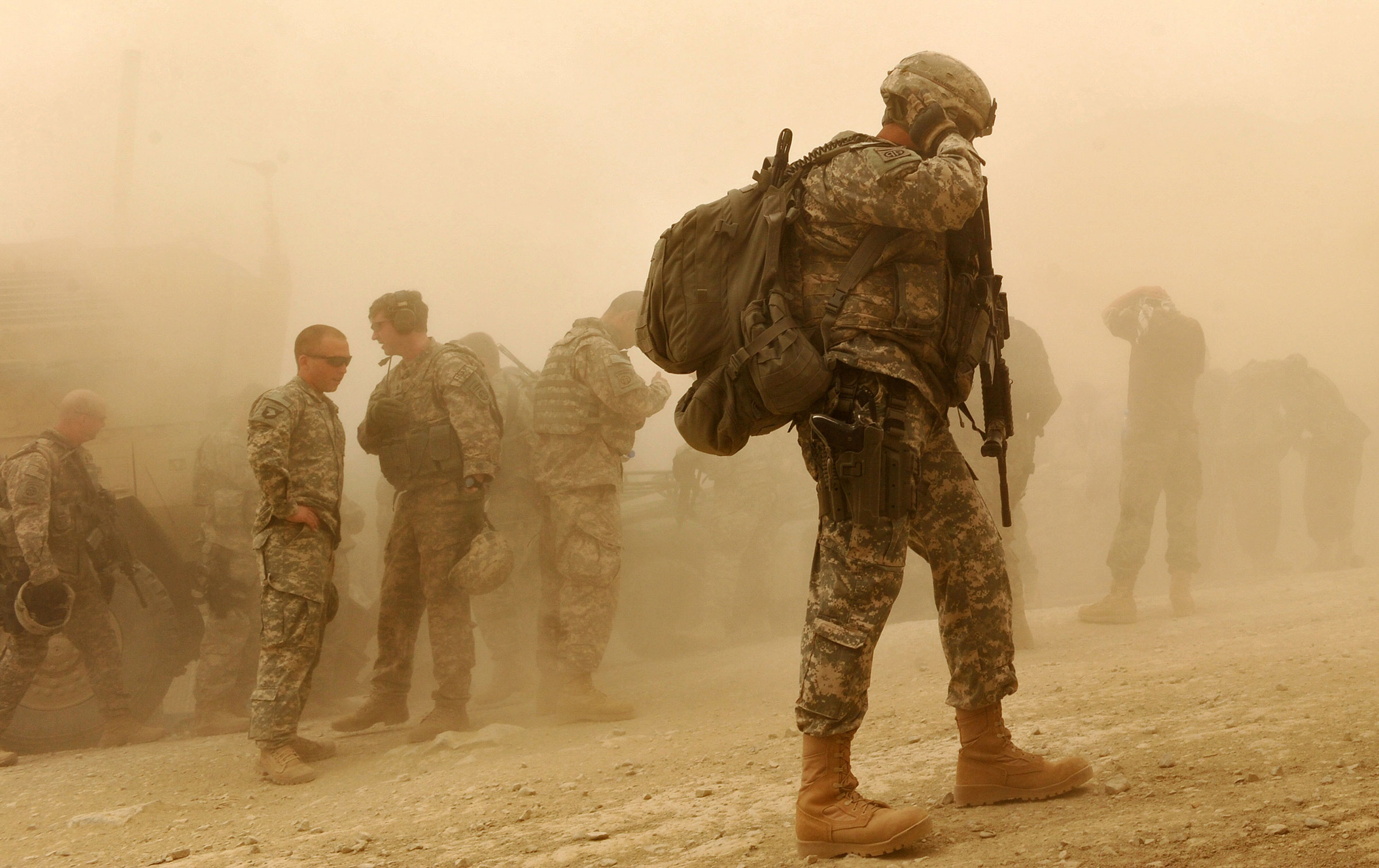 US Army soldiers walk at US military Camp Wilderness in Khost province, Afghanistan on April 10, 2010.