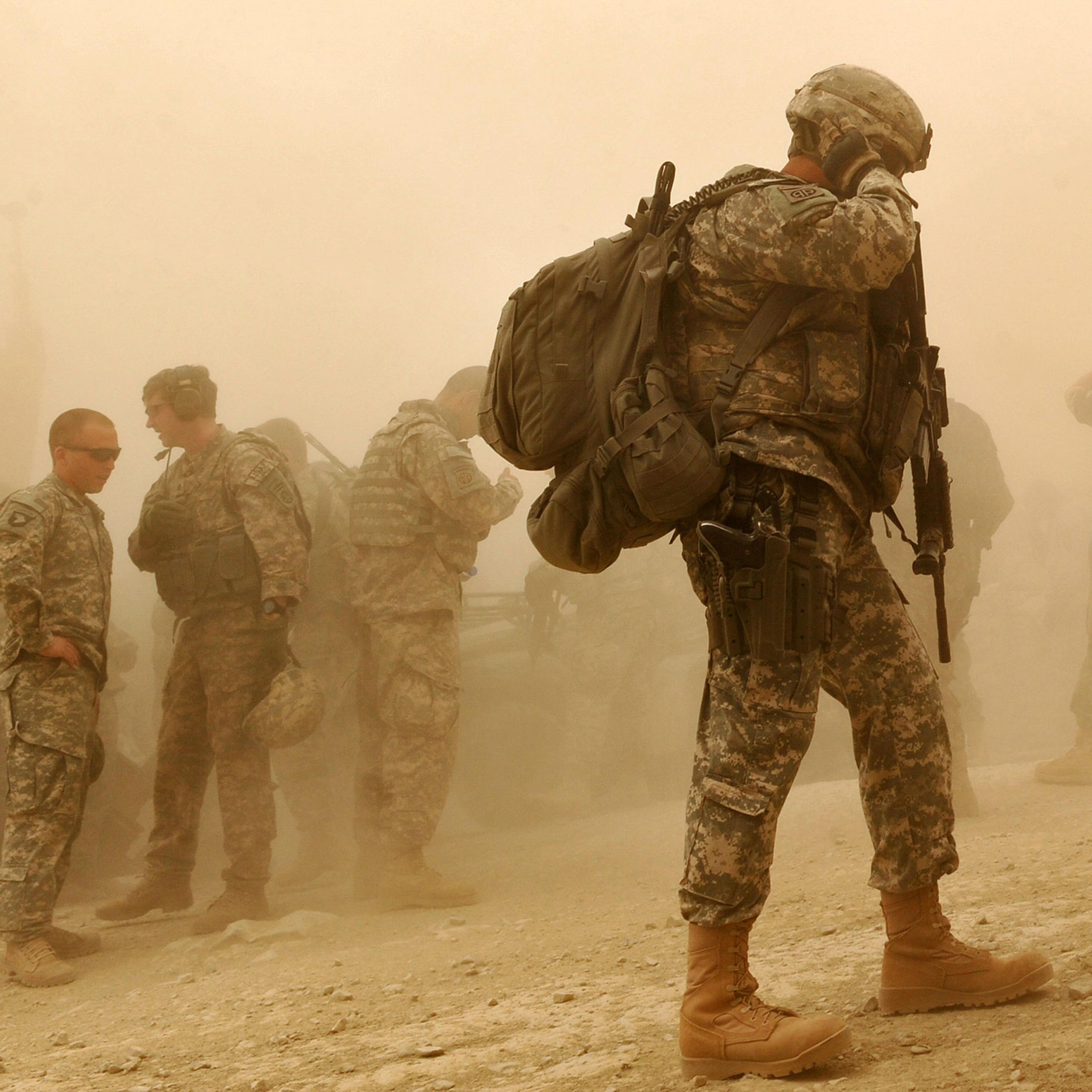 US Army soldiers walk at US military Camp Wilderness in Khost province, Afghanistan on April 10, 2010.