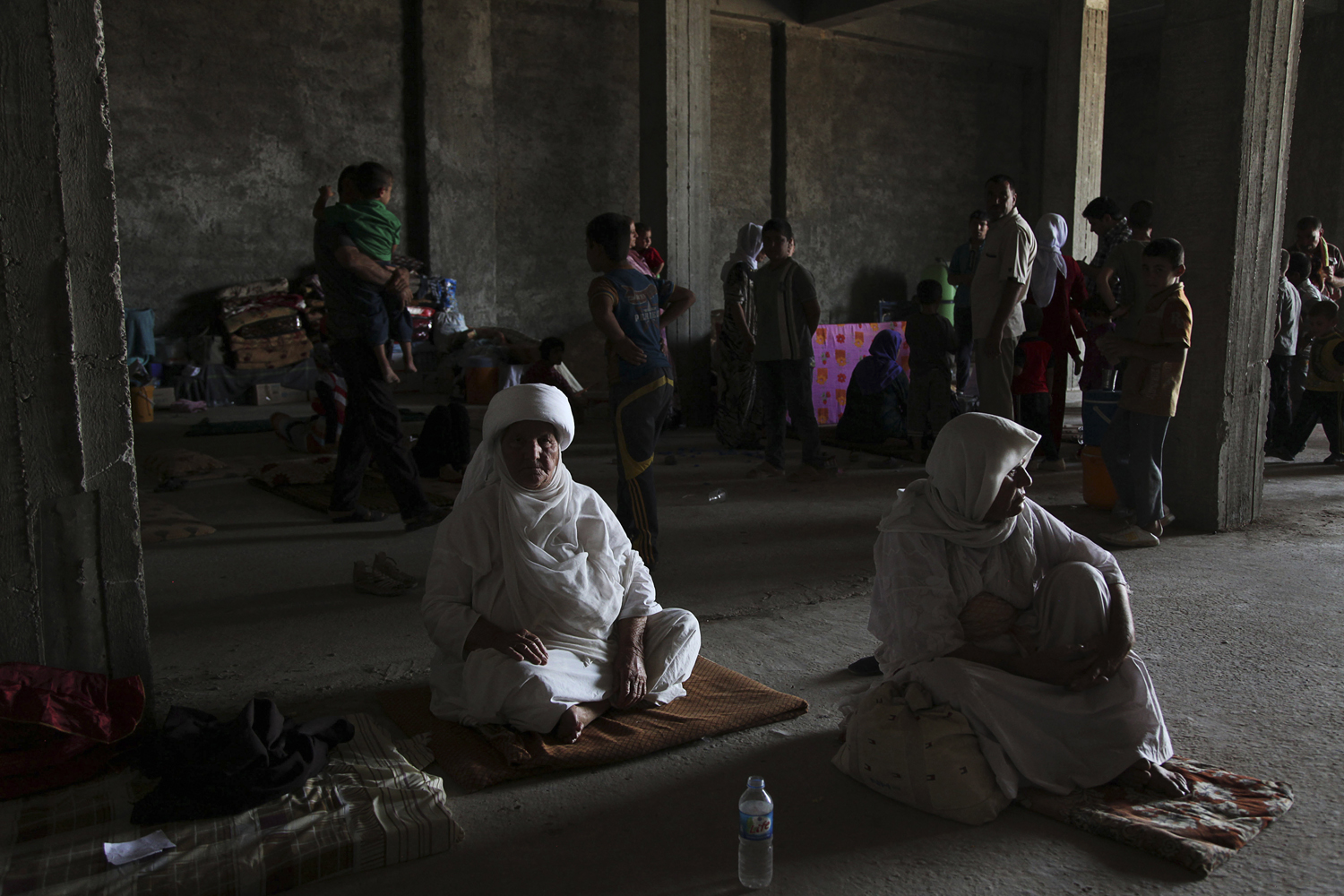 Displaced people from the minority Yazidi sect, fleeing the violence in the Iraqi town of Sinjar west of Mosul, take refuge at Dohuk province