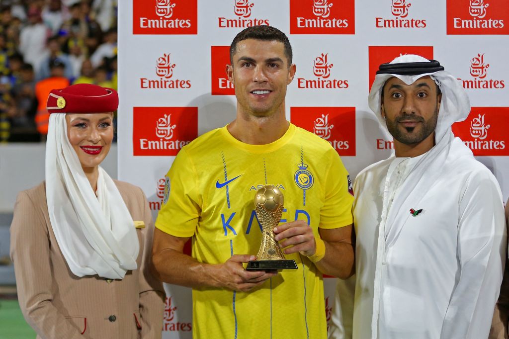 Nassr's Portuguese forward Cristiano Ronaldo poses with his top scorer trophy following the 2023 Arab Club Champions Cup semi-final football match between Saudi Arabia's Al-Nassr and Iraq's Al-Shorta at Prince Sultan bin Abdul Aziz Stadium in Abha on Aug