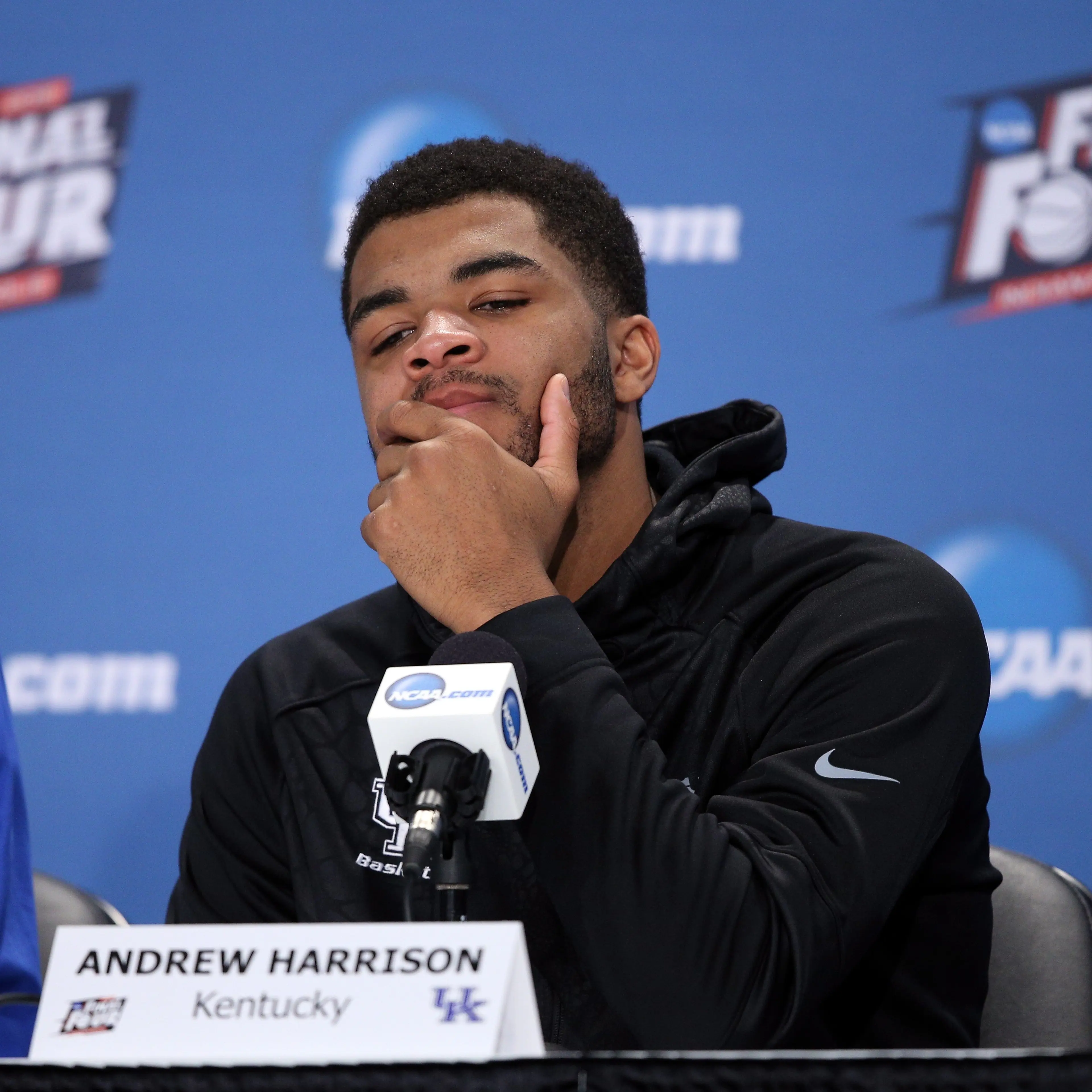 Andrew Harrison of the Kentucky Wildcats reacts in the post game press conference after being defeated by the Wisconsin Badgers during the NCAA Men's Final Four Semifinal at Lucas Oil Stadium on April 4, 2015 in Indianapolis.